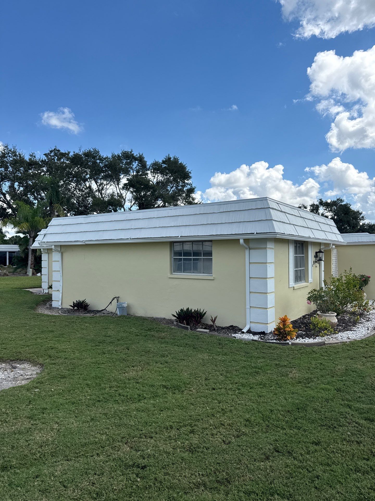 White Gutters and Matching Downspouts in Sarasota FL by Gutter Professors