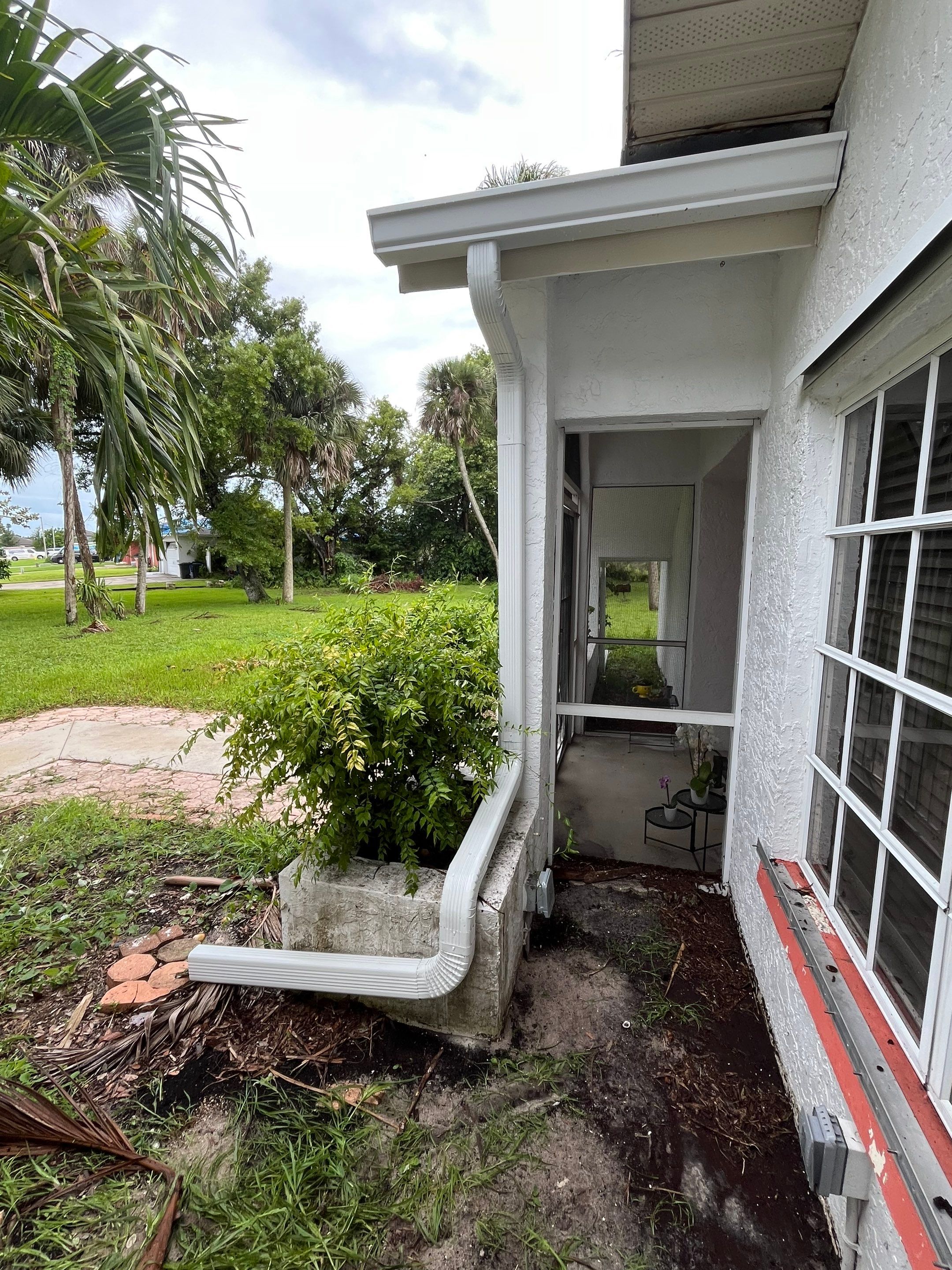 White Seamless Gutters with Splash Guards in North Fort Myers FL by Gutter Professor   by Gutter Professors