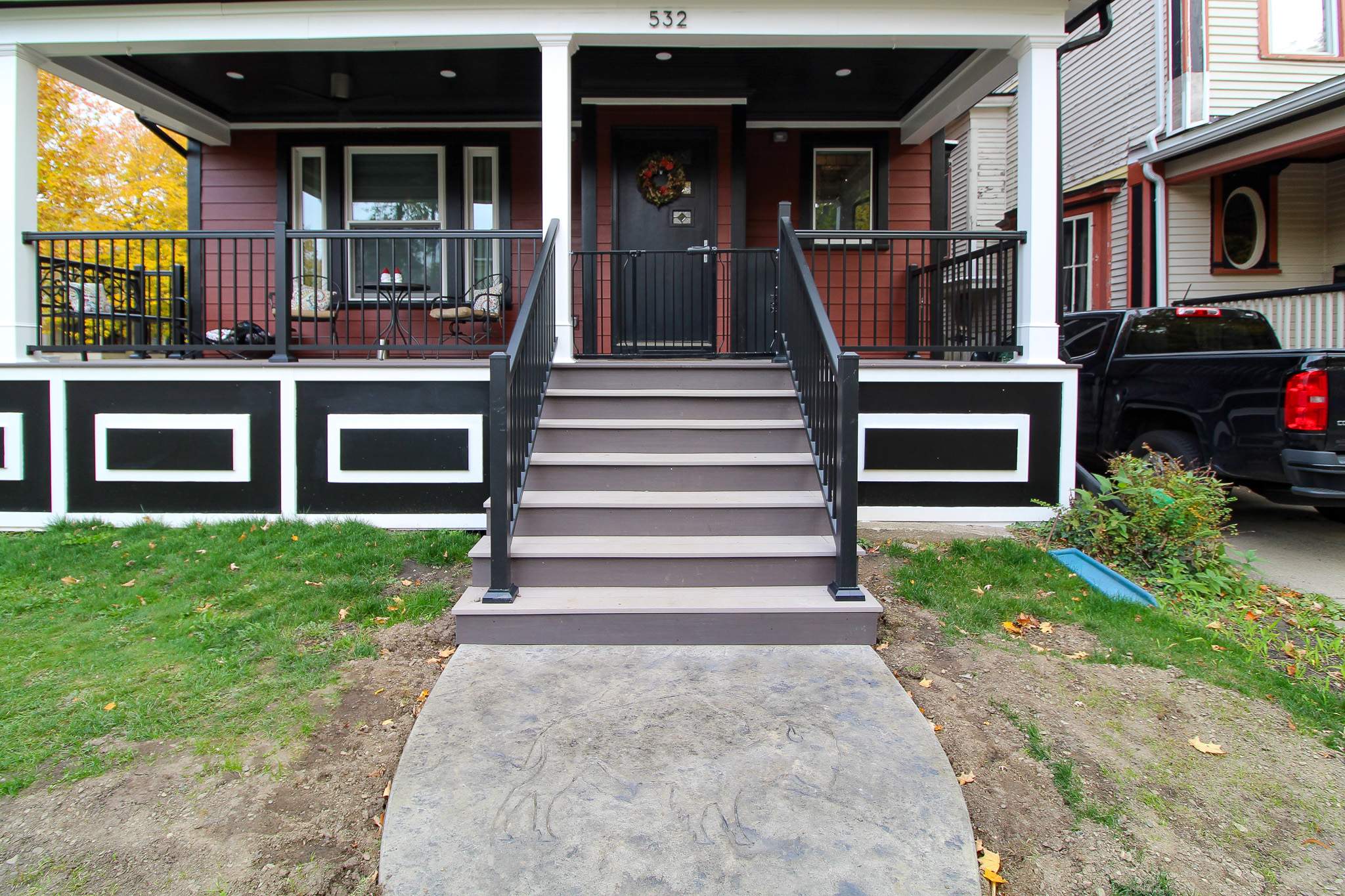 Exterior Renovations- Siding, Stamped Concrete, Porch, and Railings by Ivy Lea Construction