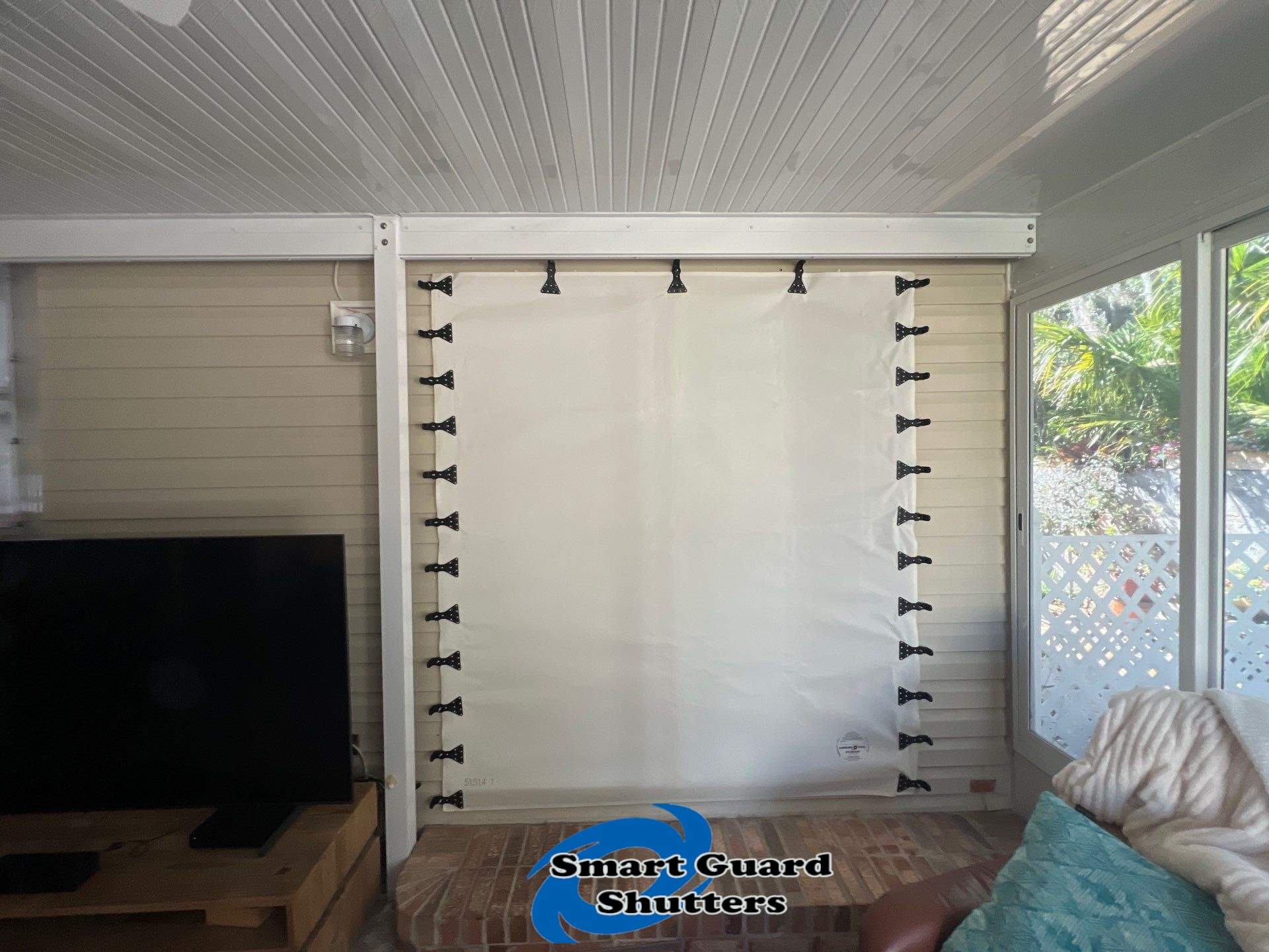 Accordion Shutters & Hurricane Fabric by Smart Guard Shutters
