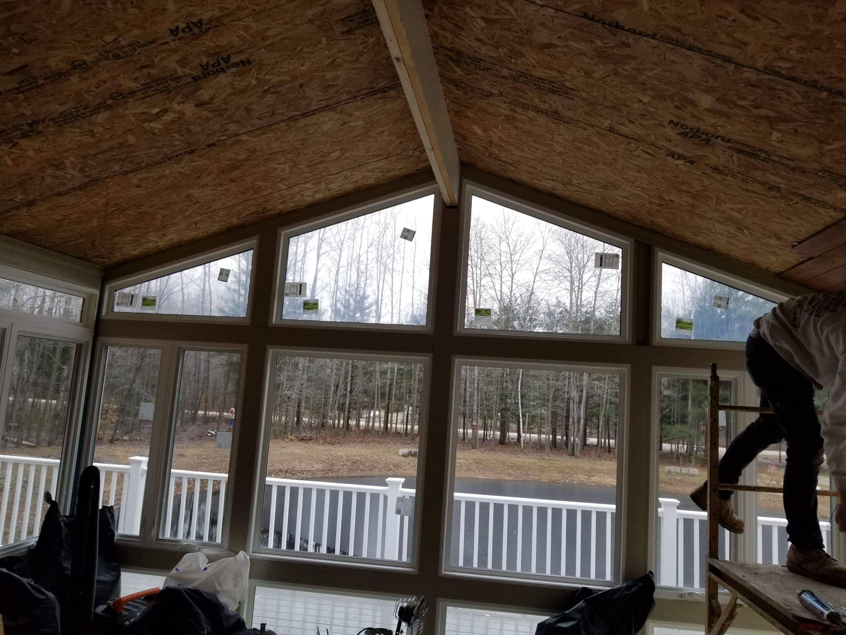 Sunroom and deck addition. by Energy Plus Home Improvements