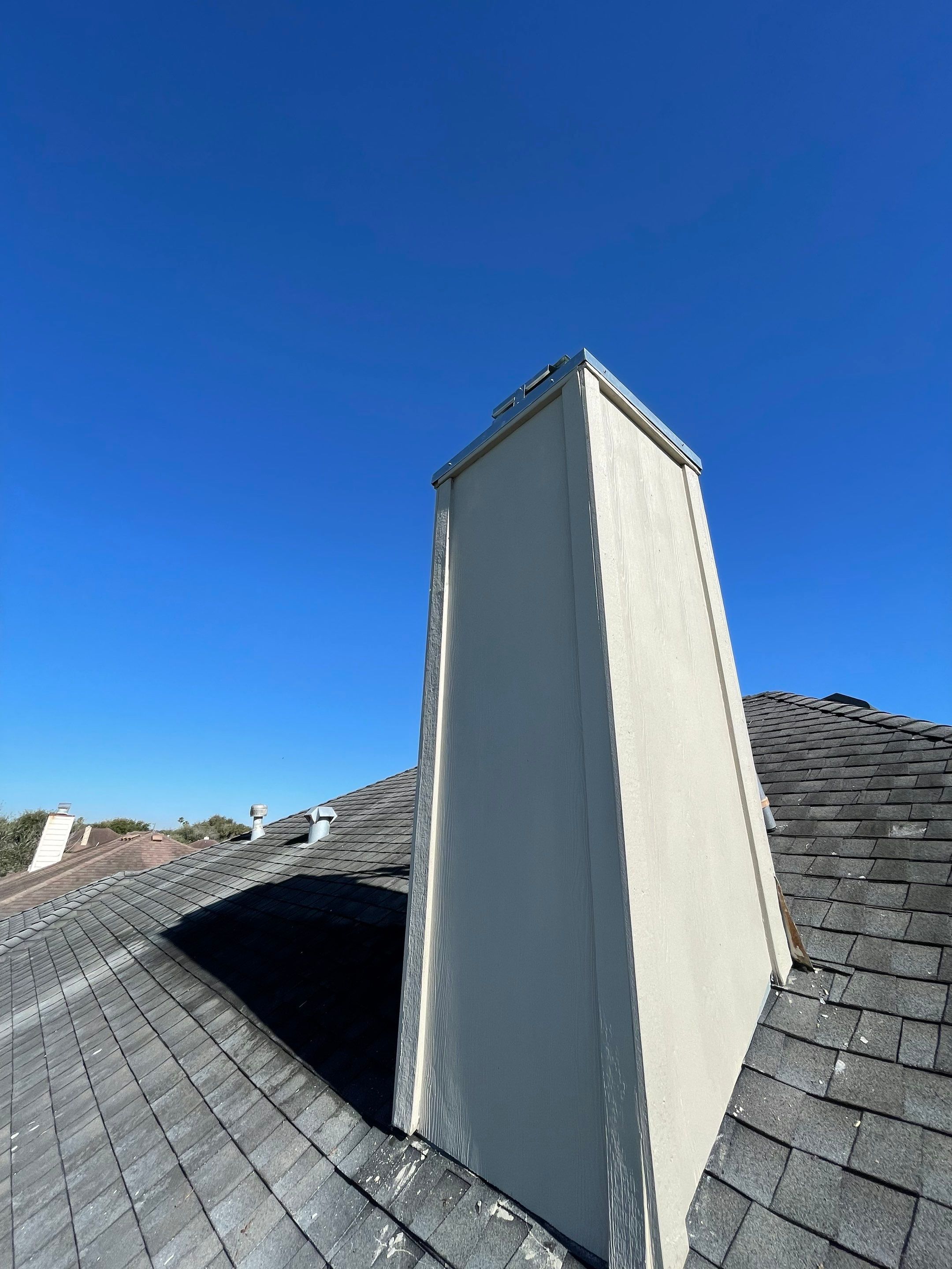 Residential Roofing Repair Replacing Chimney Cap by Lighthouse Roofing