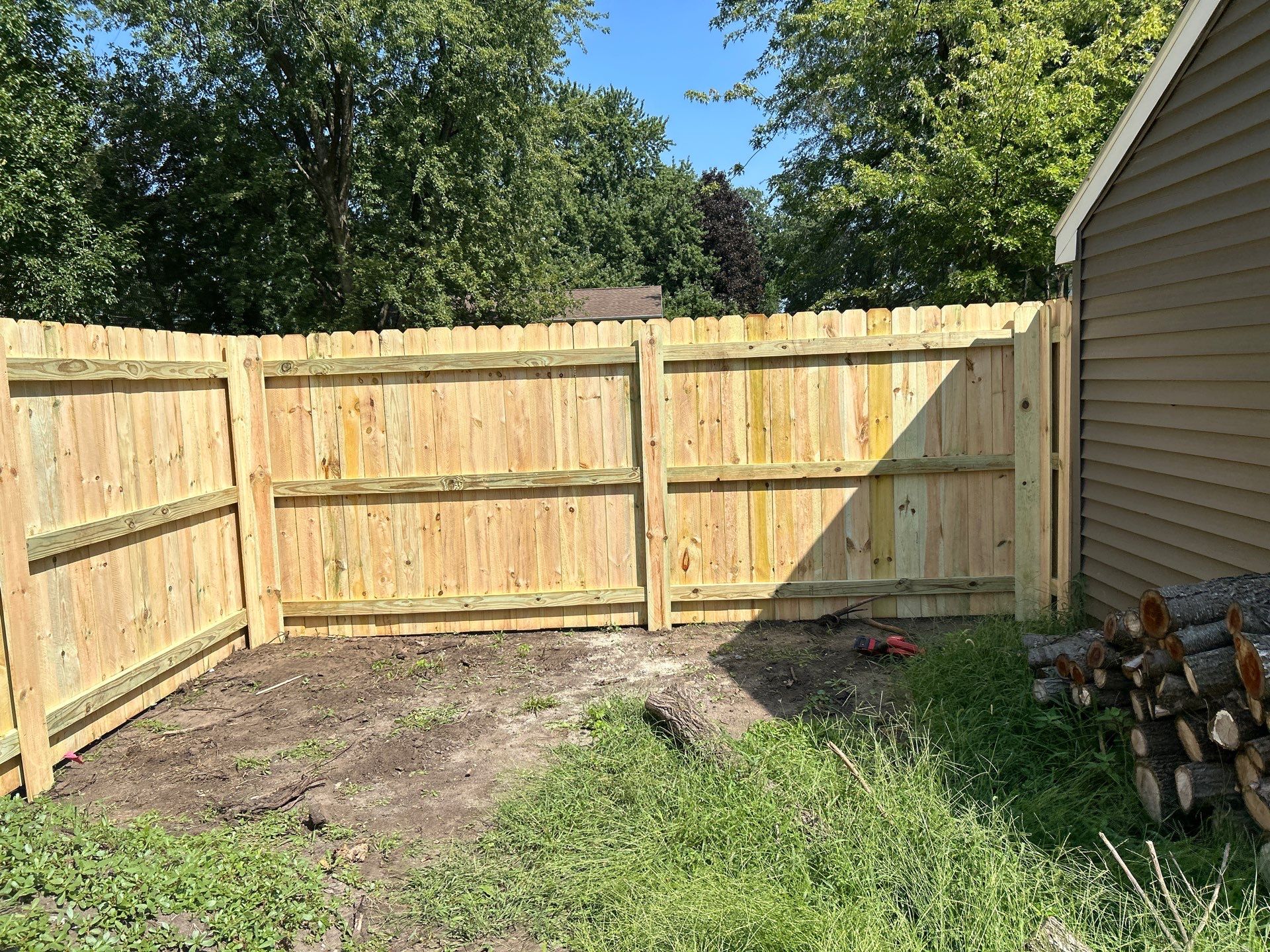 Treated Pine Privacy and Picket Fence Installation in Evansdale by Perfect Picket Fence and Stain