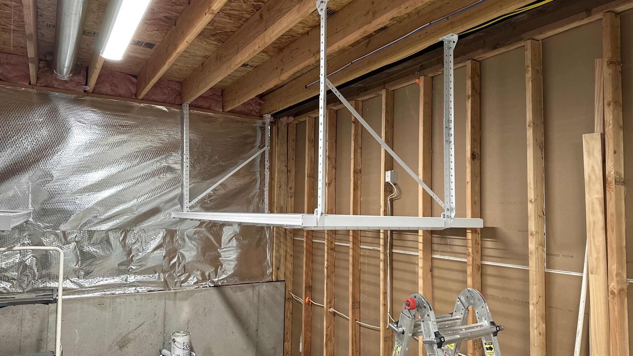 Brandon C. added these overhead racks to upgrade his storage  by Banner Garage