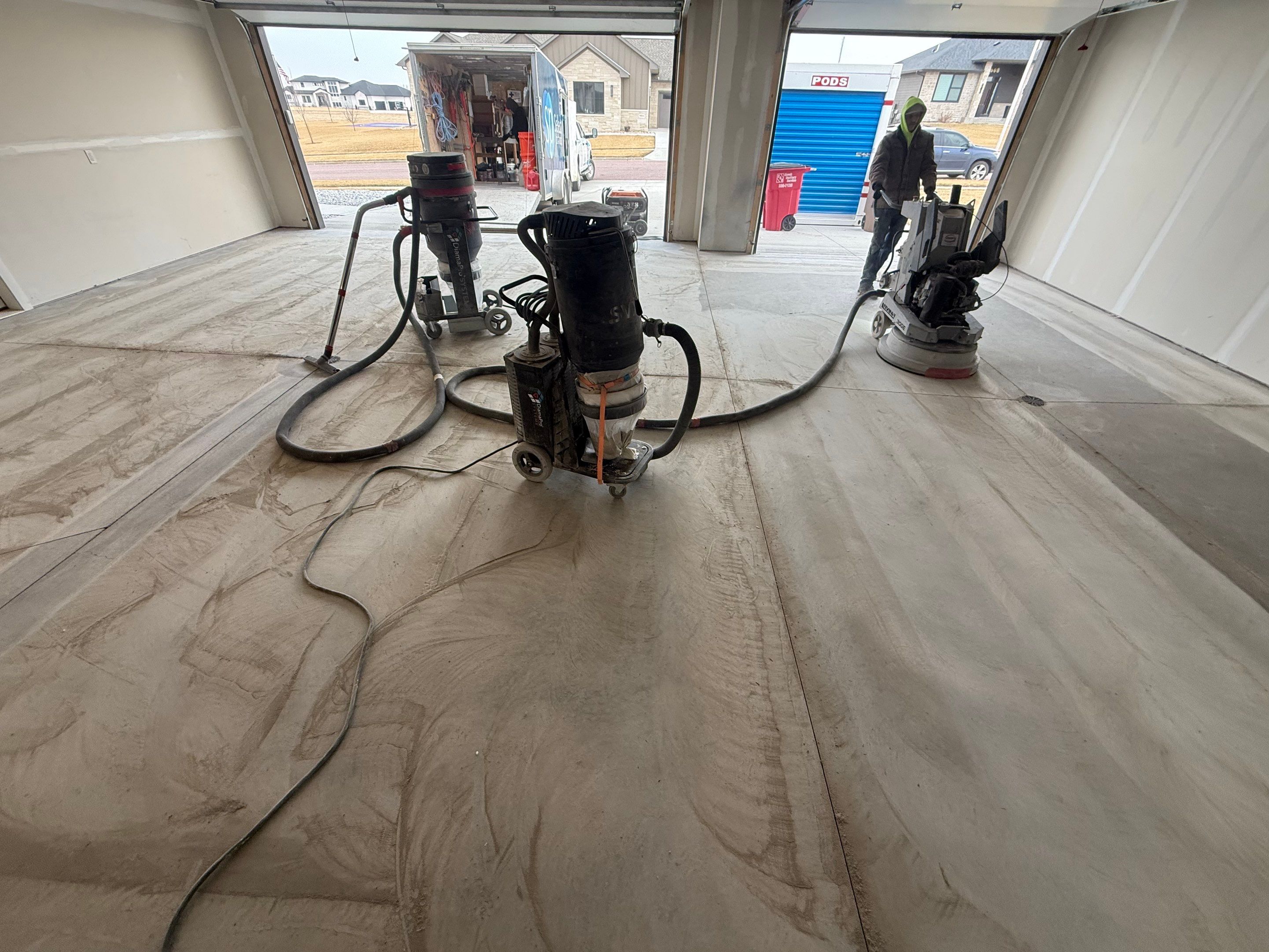 Grey Speckled Epoxy Floor Coating for Sioux Falls Garage by Select Painting, Coatings & Garage Cabinets