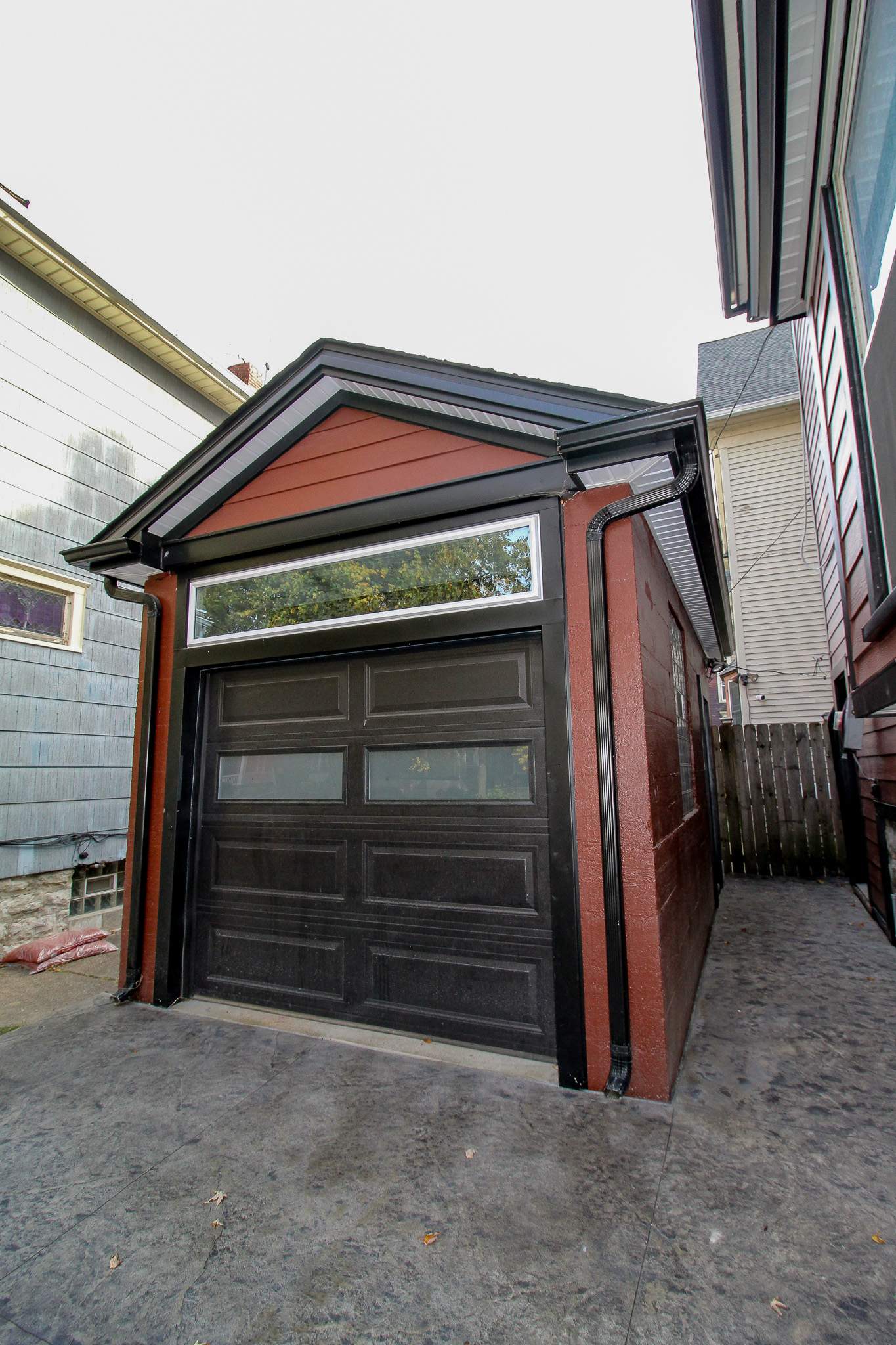 Exterior Renovations- Siding, Stamped Concrete, Porch, and Railings by Ivy Lea Construction