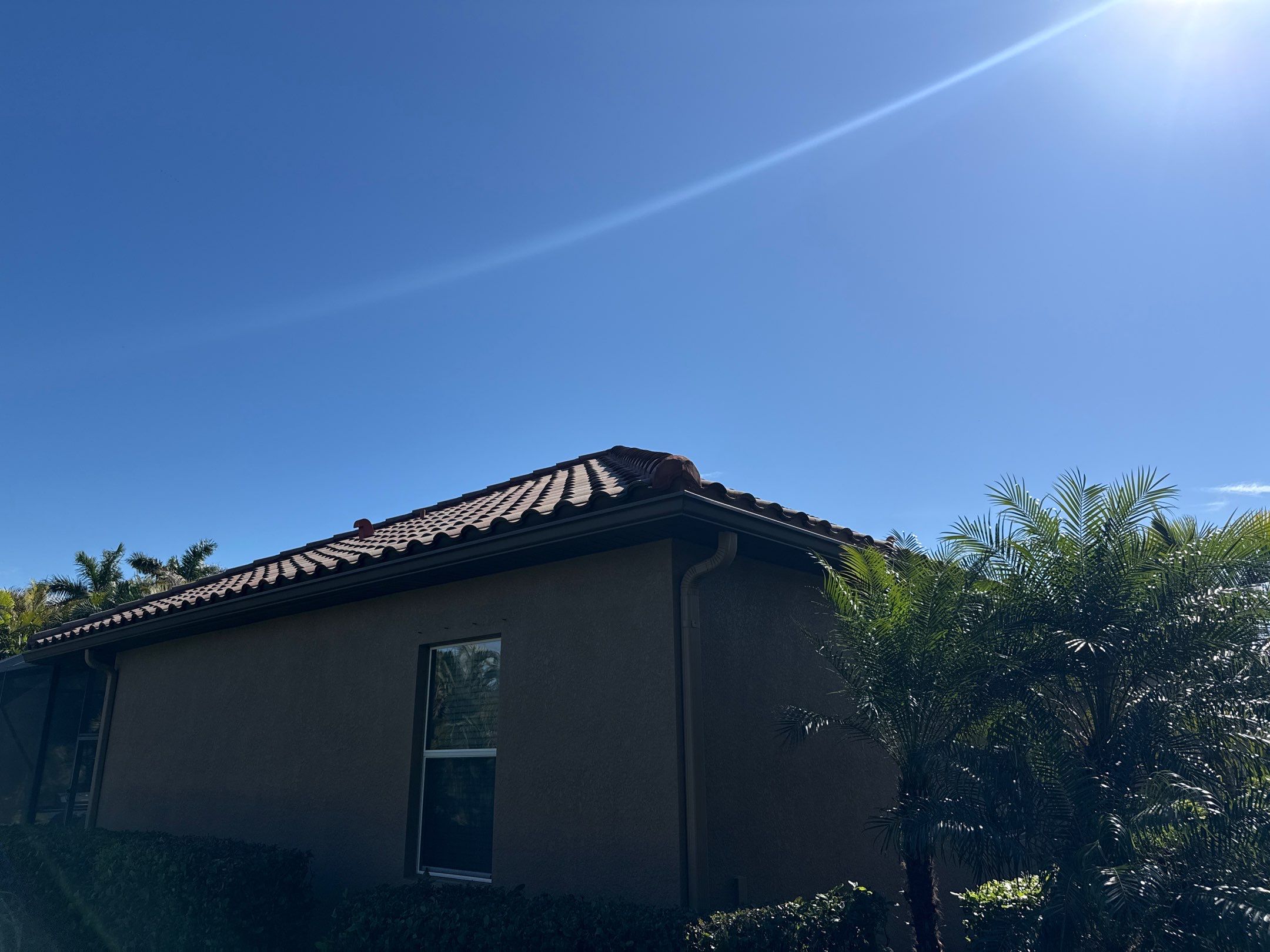 This project focused on a full gutter clean-out to restore proper water flow and prevent overflow issues.  Our scope of work included: 	•	Removing heavy leaf and pollen buildup from the gutter system 	•	Clearing out clogged sections along the rear gutters near the pool cage, where debris tends to accumulate more heavily 	•	Inspecting and cleaning the front gutter guards, which had several blocked areas restricting water flow 	•	Ensuring all downspouts and channels were flowing properly after service  Even with gutter guards installed, debris like pollen, shingle grit, and fine organic matter can still build up over time—especially in Florida’s environment. Regular maintenance helps prevent water damage, overflow, and staining on exterior surfaces.  Another thorough job completed by Sunshine AquaWash® – keeping homes protected from top to bottom. by Sunshine AquaWash