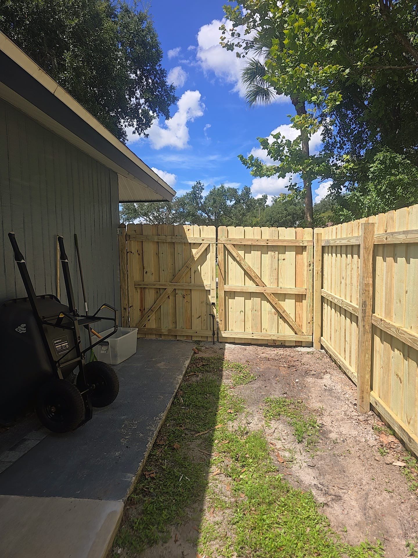 Wood Privacy Fence Installation with Double Gate in Port Charlotte by True Fence LLC
