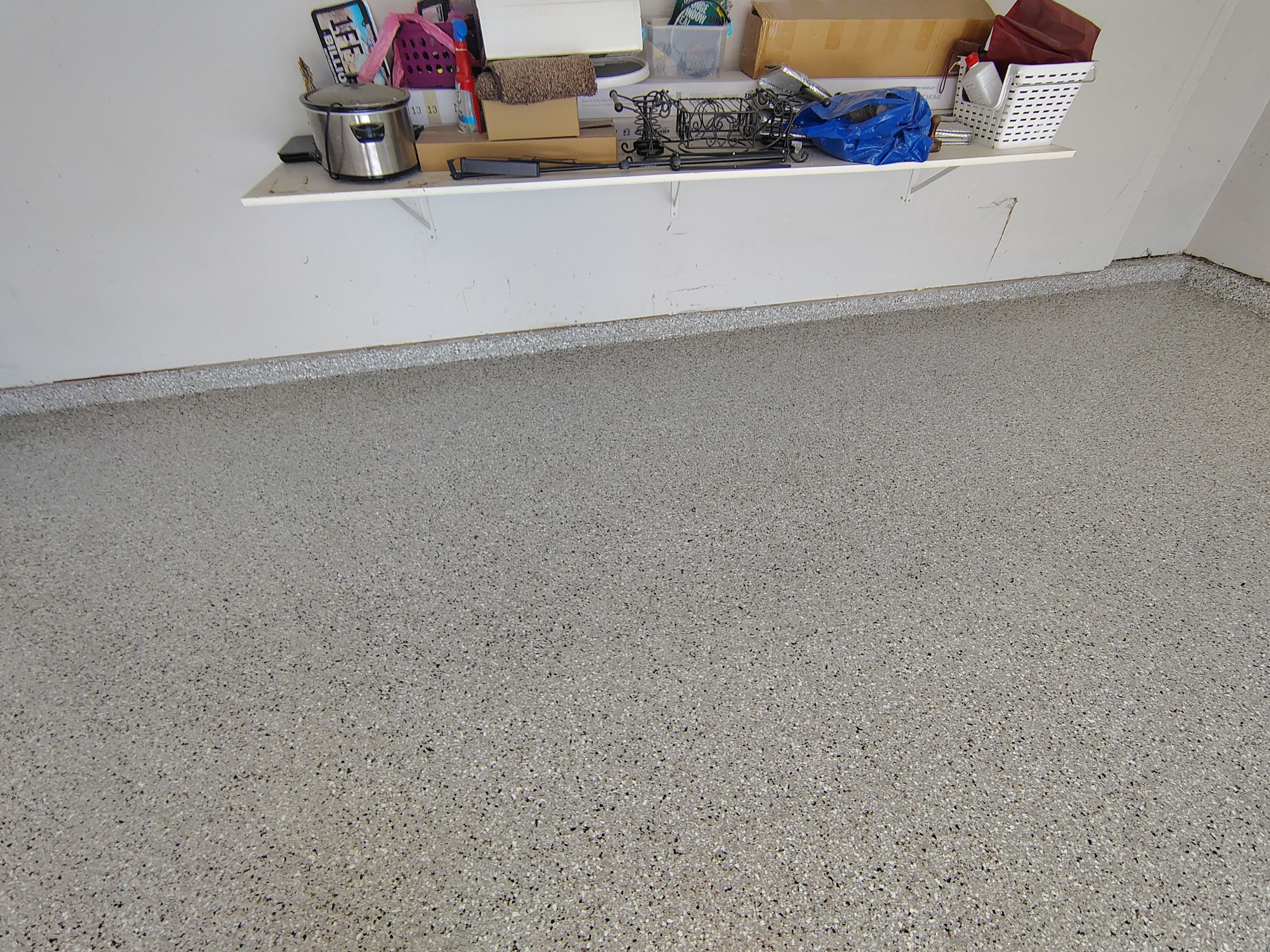 Decorative Chip Epoxy Garage Floor Coating in Sioux Falls by Select Painting, Coatings & Garage Cabinets