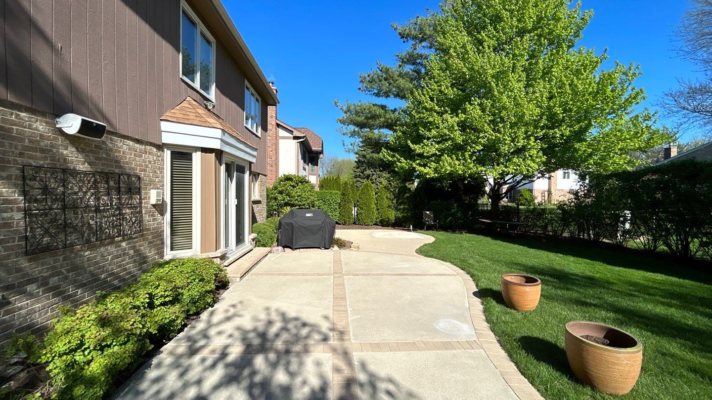 concrete patio and driveway cleaning by Northern Power Washing LLC.