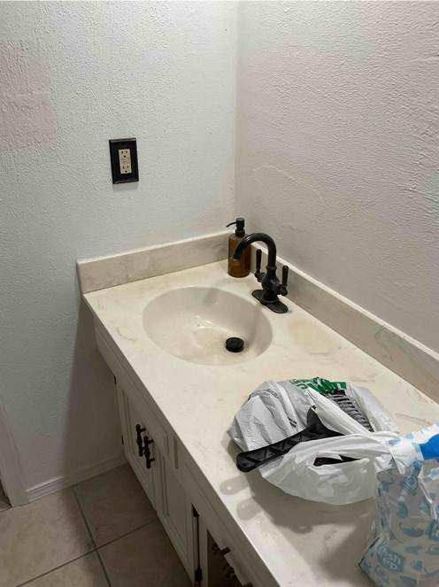 New shower, flooring, and countertop by The Shower Company