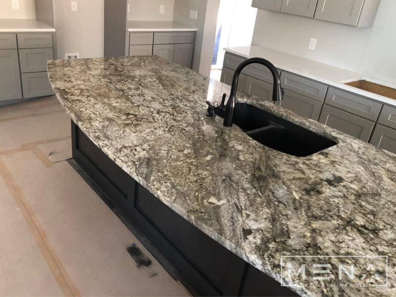 Kitchen countertops using Blue Dunes Granite by Mena stone surfaces