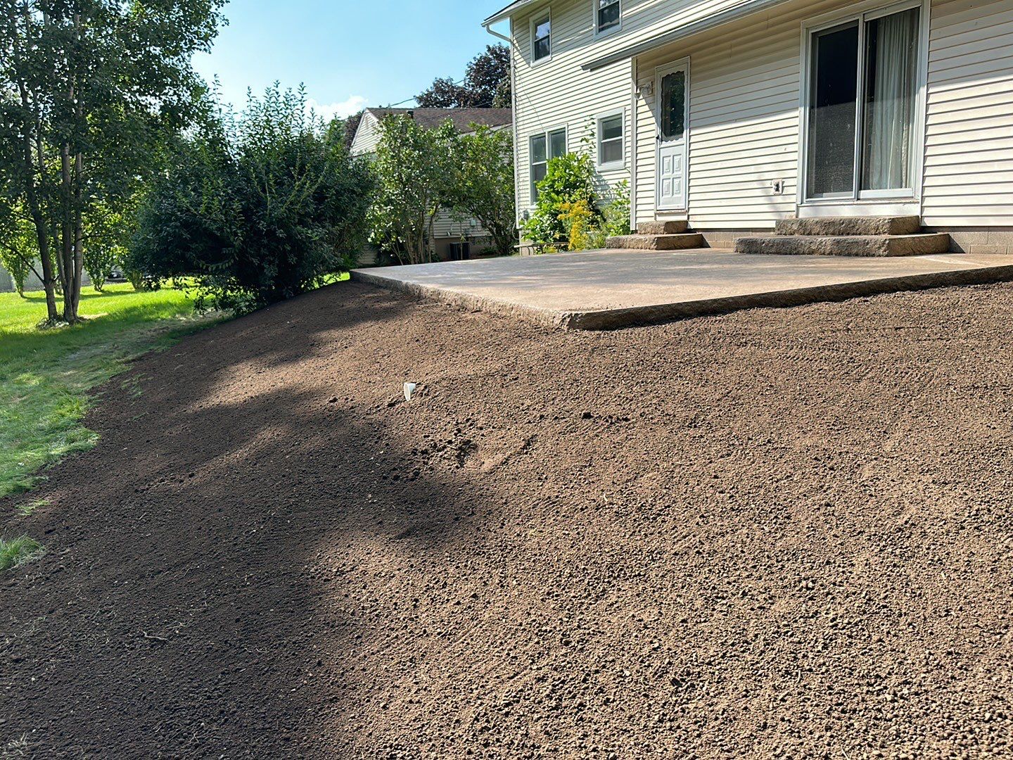 Bluestone textured stamped concrete patio by NG Masonry & Construction LLC