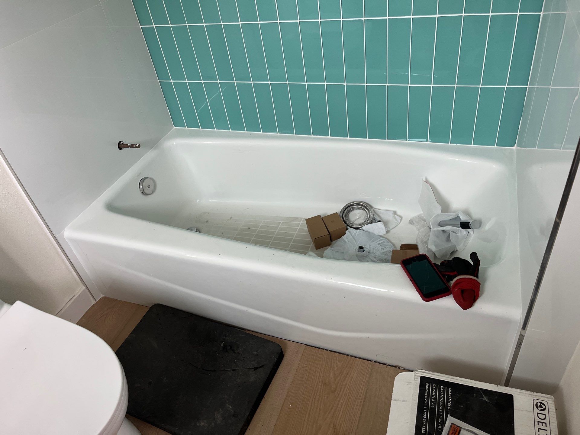 Scope of Work: Installation of Shower, Toilet, Sink, Fixtures, Pipes, and Seals by Us Plumbing