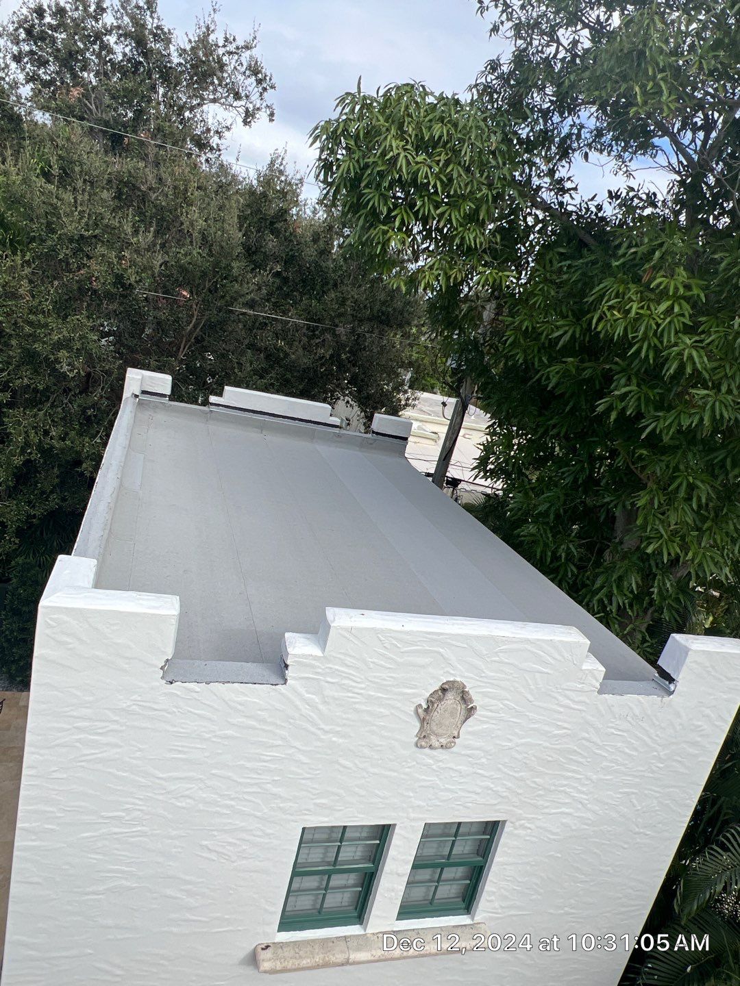 West Palm Beach Roof Restoration and Travertine Paver Driveway Installation by Aastro Roofing