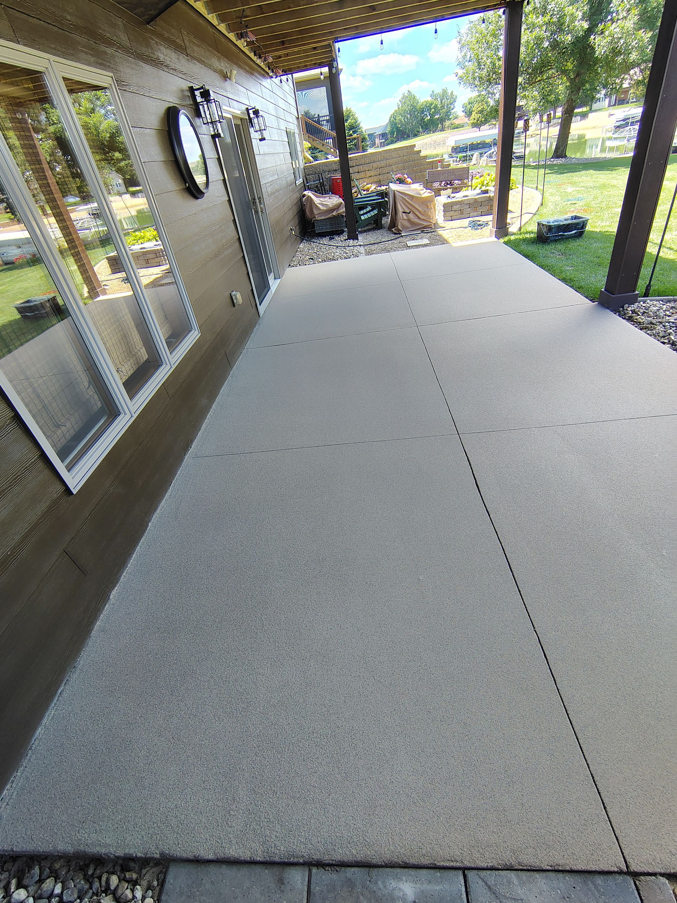 Textured Concrete Coating and Entryway Restoration in Madison by Select Painting, Coatings & Garage Cabinets