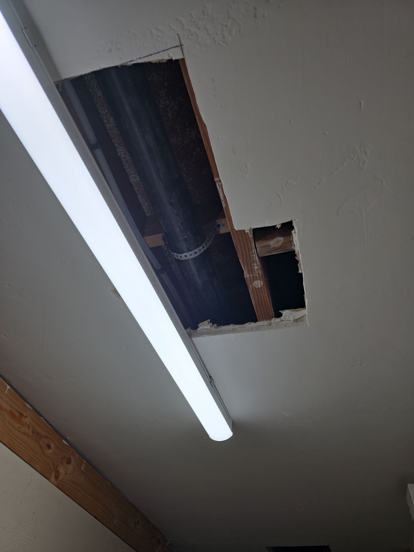 Installation of New Tall Black Piping (Wall to Ceiling) & Underground Piping by Us Plumbing