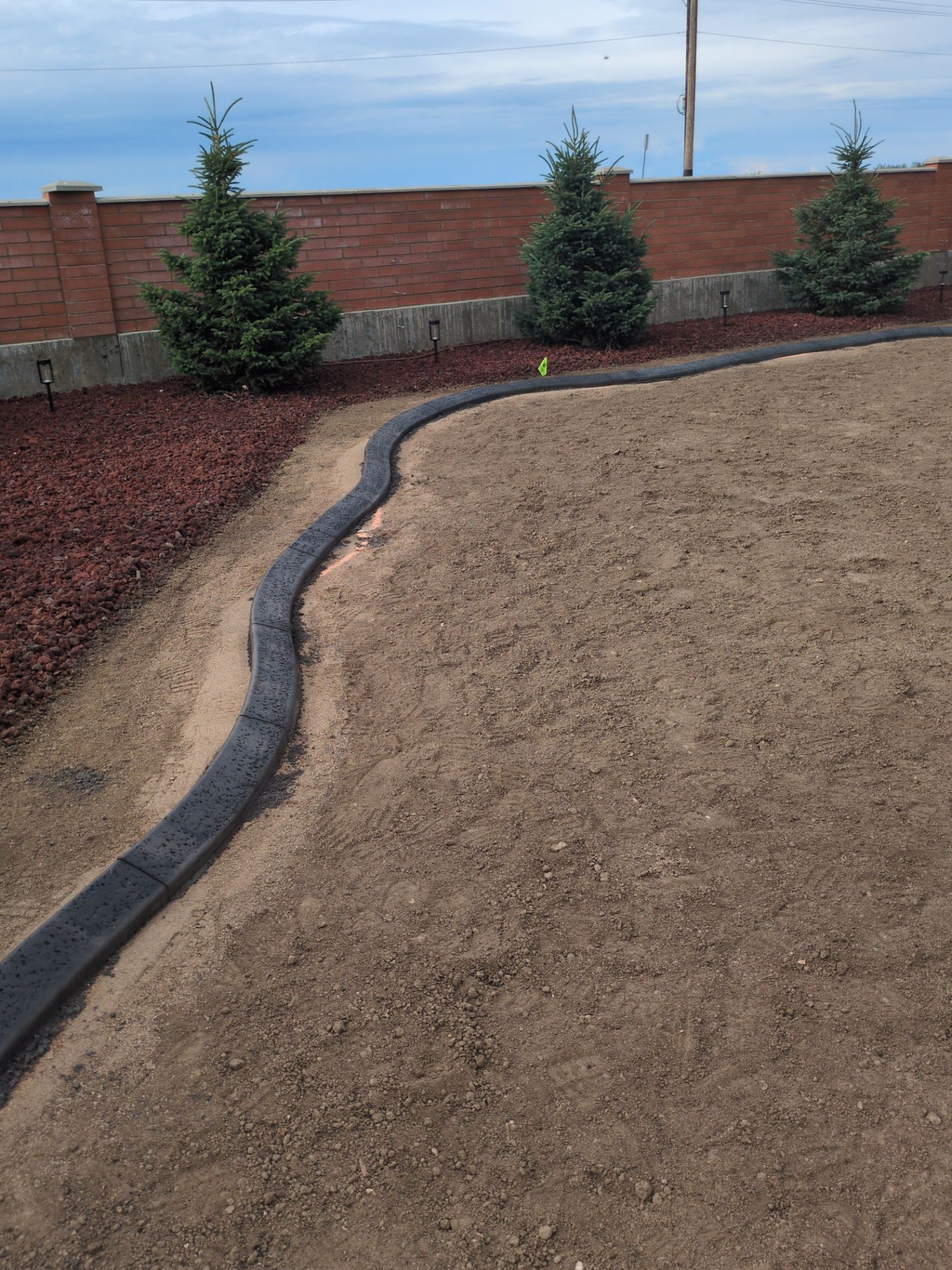 Custom Decorative Concrete Curbing Installation in Desert Blume by Pump it Up Concrete Jacking