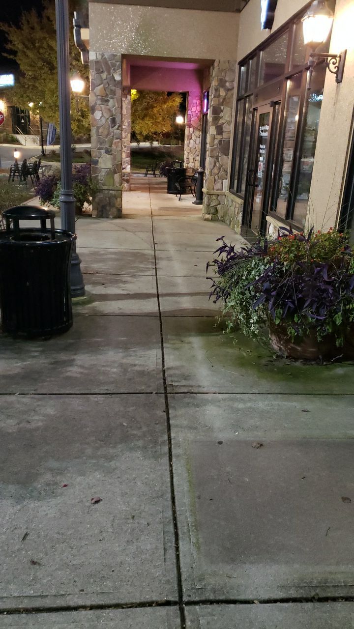 contrete cleaning using cleaner by Power Wash Masters LLC