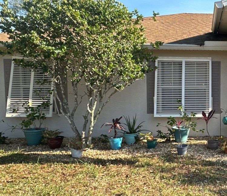 Hurricane Rated Bahama Shutters in Cream by Smart Guard Shutters