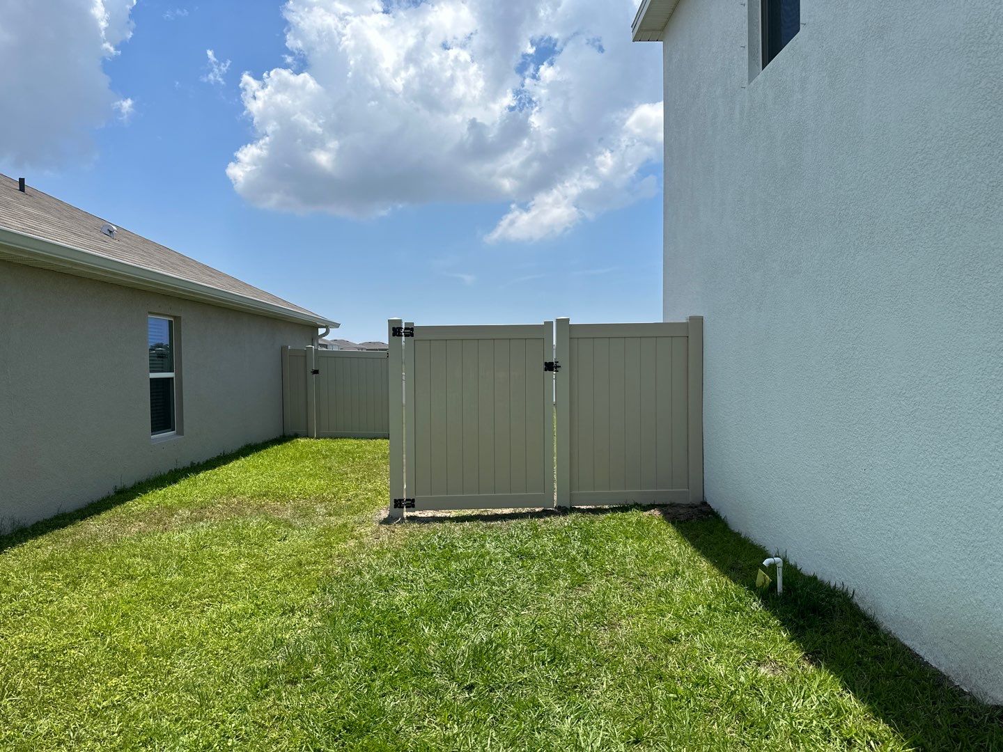 Aluminum Fence Installation using Black 3 Rail Aluminum Fence and Tan Vinyl Privacy Fence by Asap fence and gates, LLC