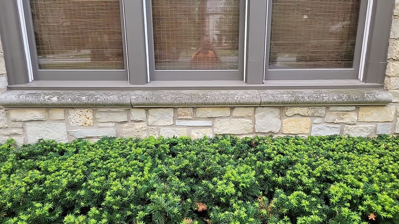 Northbrook, IL stucco home soft wash and stone cleaning by Northern Power Washing LLC.