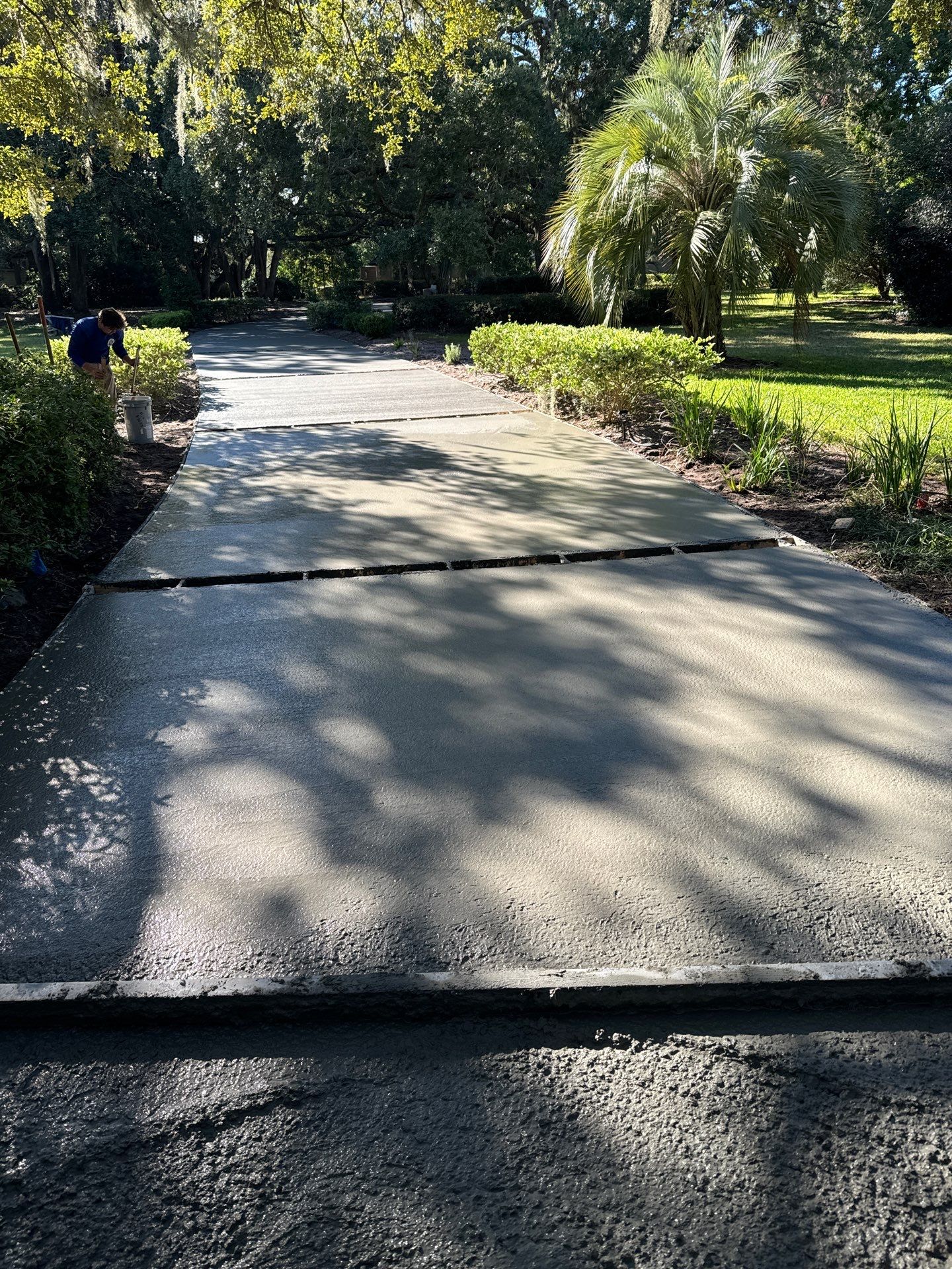 Custom Concrete Driveway with Decorative Paver Inlays in Hilton Head Island by Lowcountry Scapes, LLC