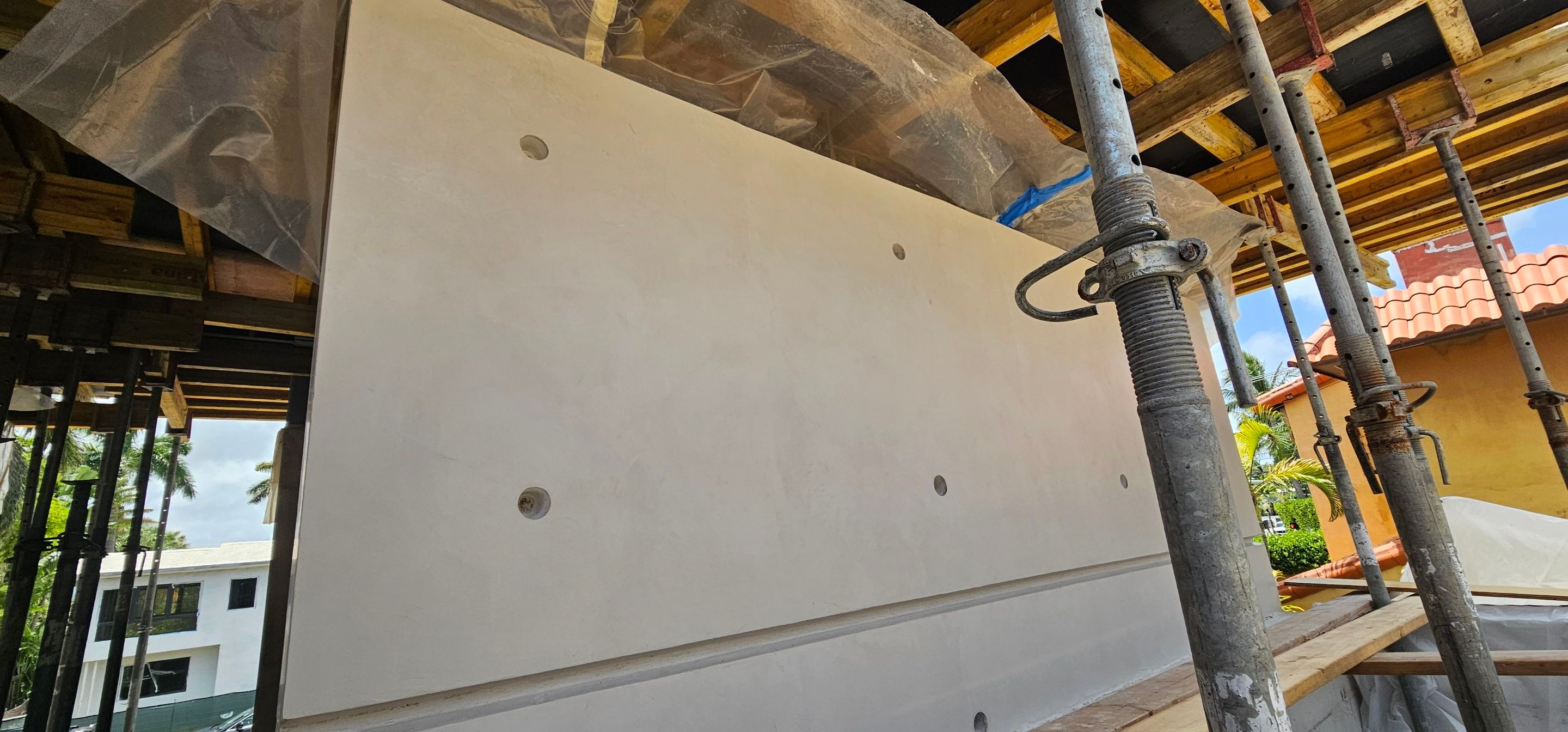 Microtopping over Exterior Walls by Seamless Surfaces