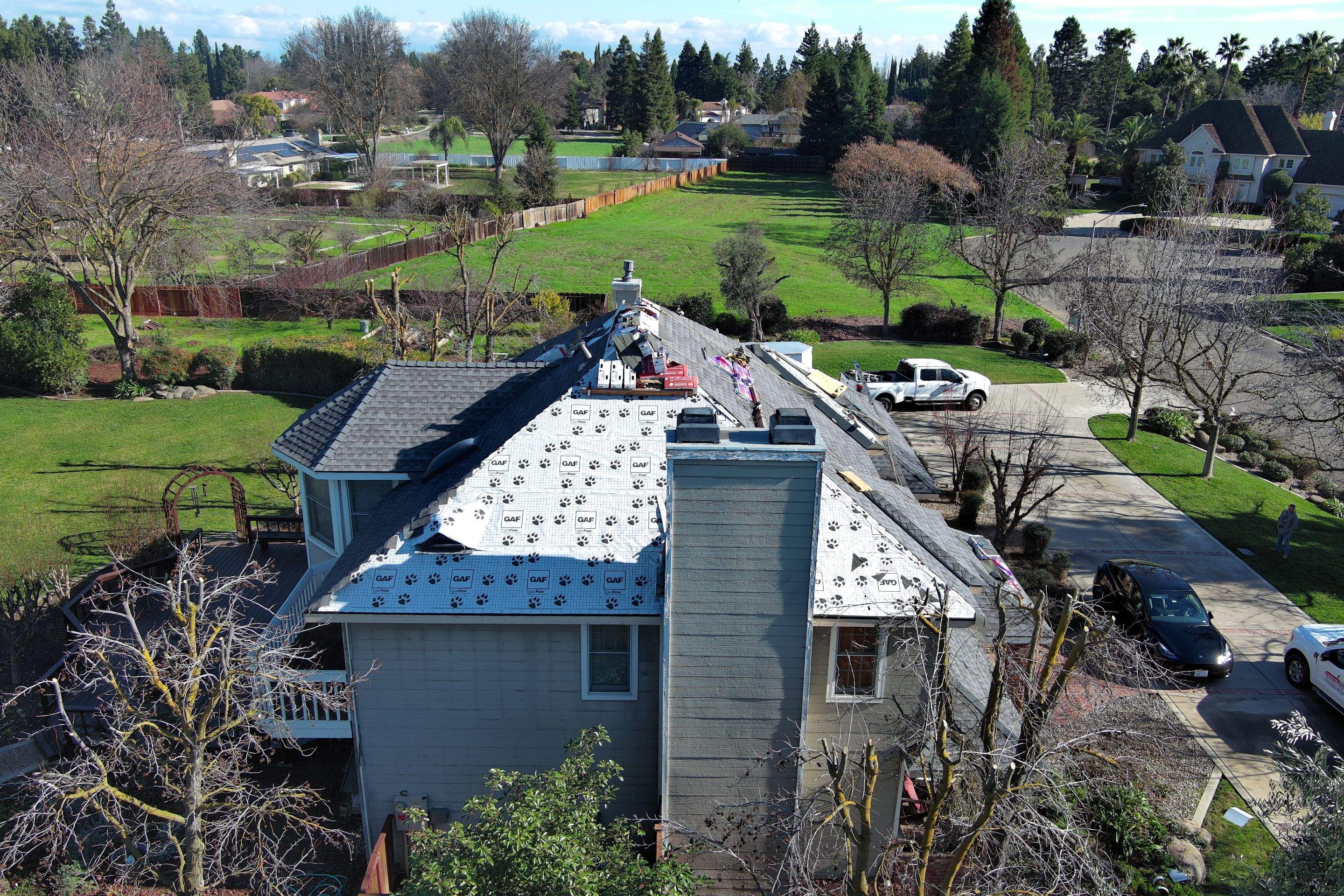 New shingles and gutters using GAF Timberline HDZ shingles and aluminum gutter by Straight Edge Roofing Inc