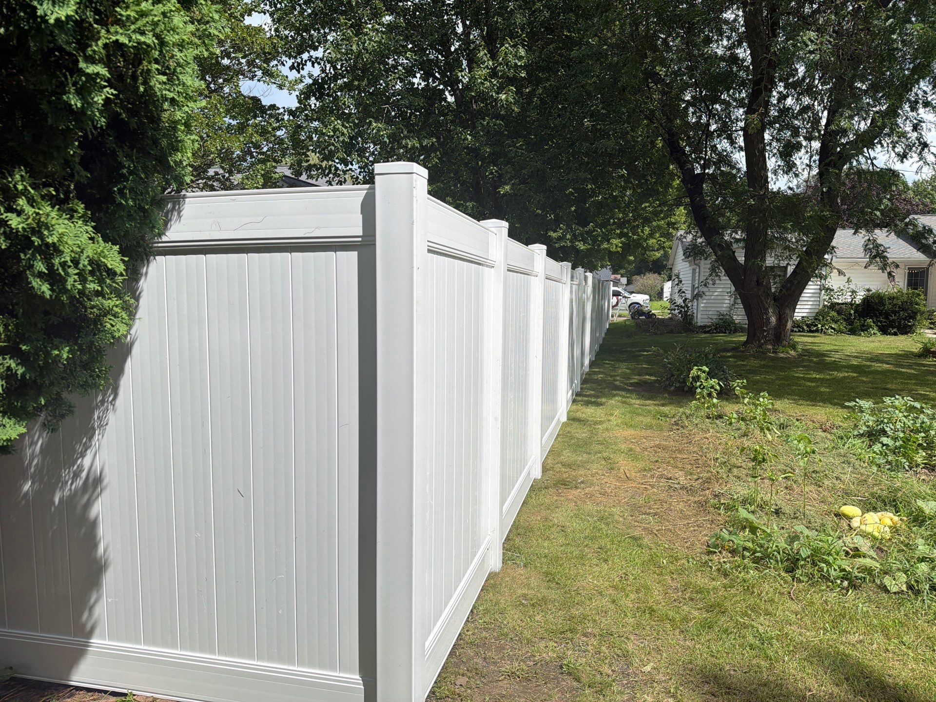 Residential White Vinyl Privacy and Black Chain Link Fencing in Jesup by Perfect Picket Fence and Stain