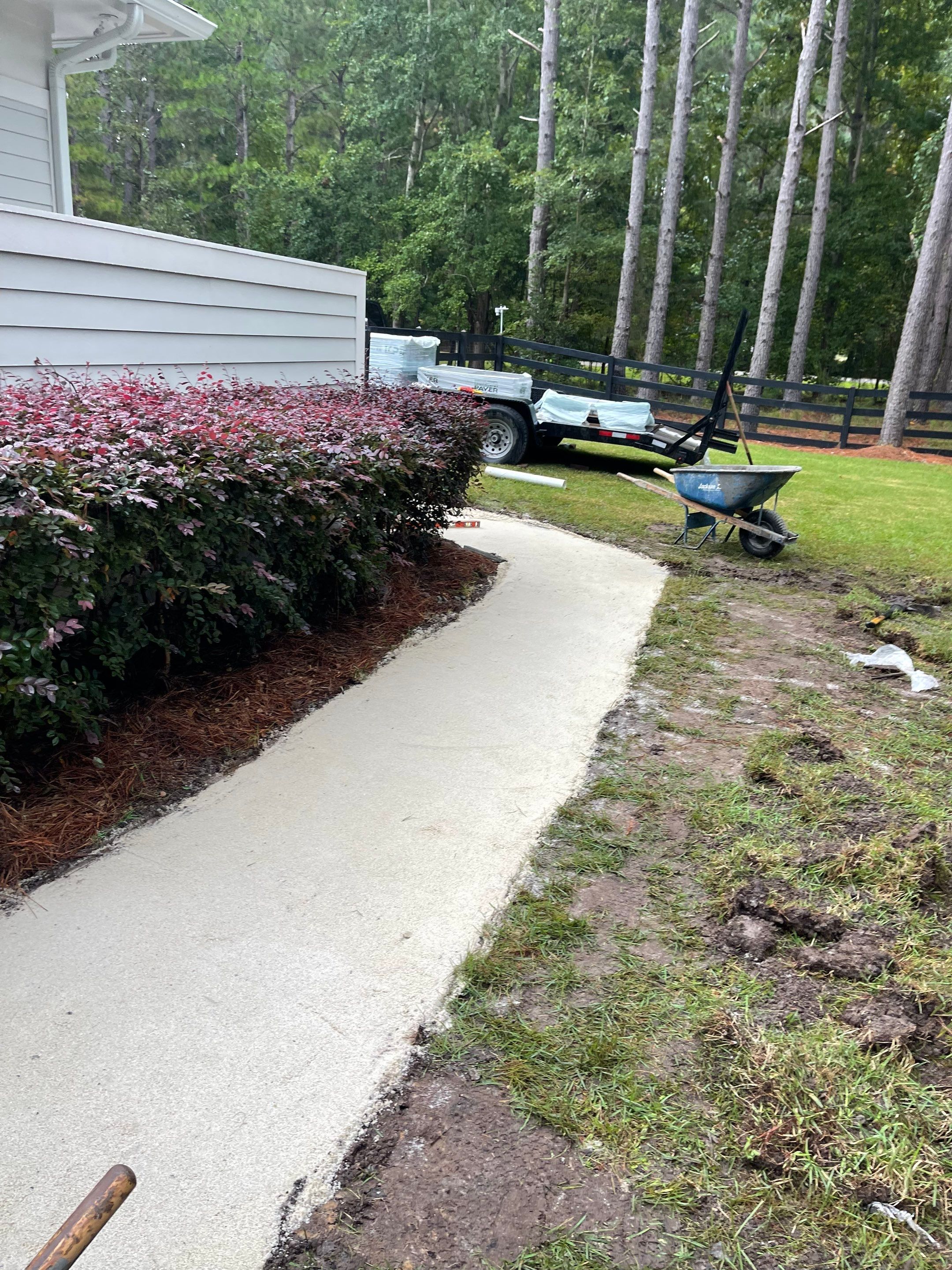Curved Gray Paver Walkway Installation in Bluffton by Lowcountry Scapes, LLC