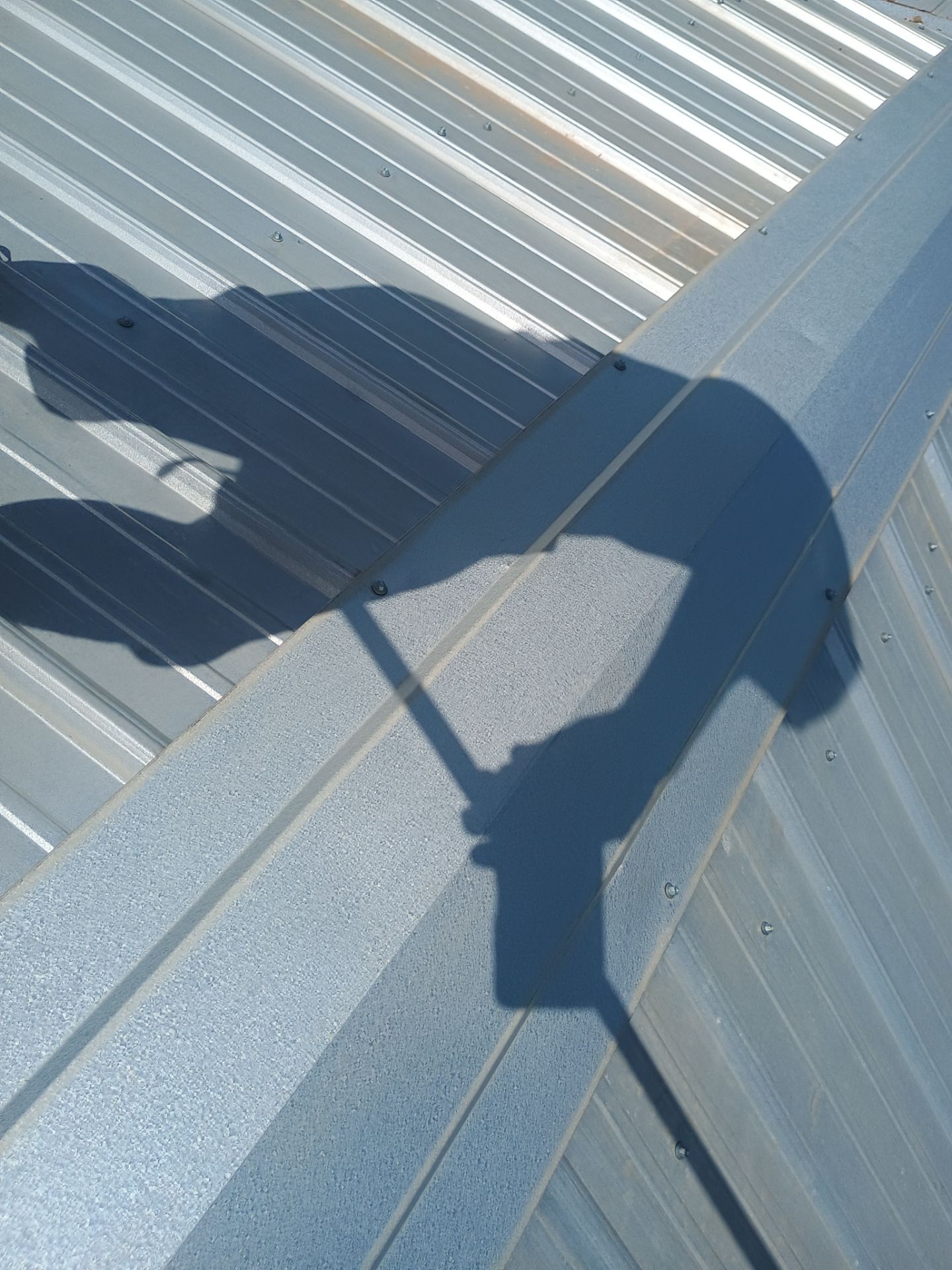 Corrugated Metal Roof Repair for Brick Home in Lindsay by BANA Roofing and Solar Supply