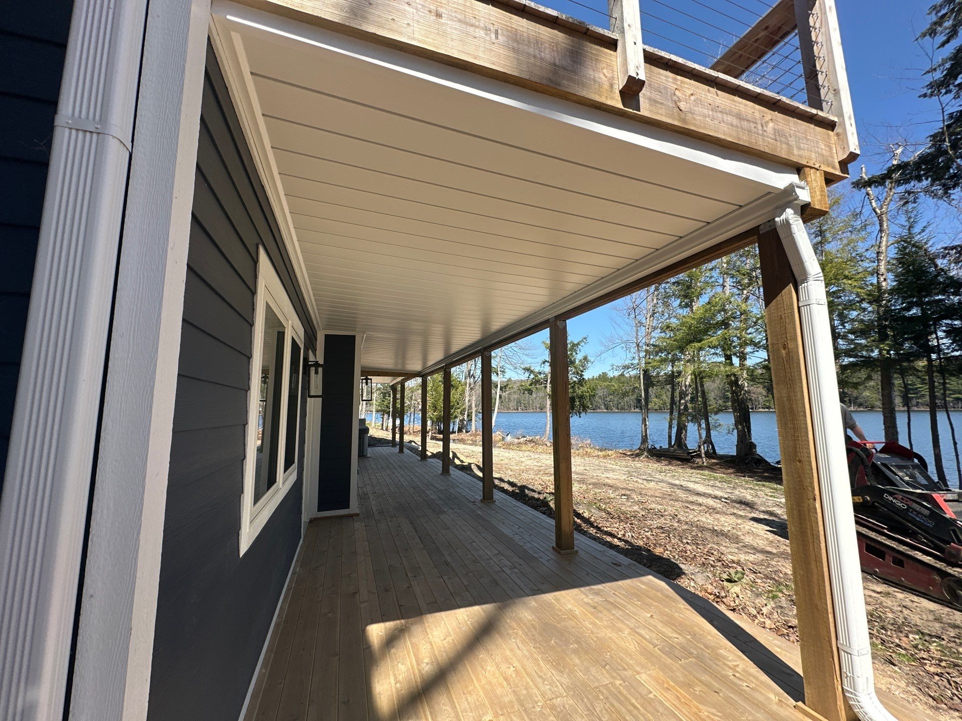 Gutter Helmet and Underdecking Installation for Alden Lakefront Home by Rainbow Seamless Systems