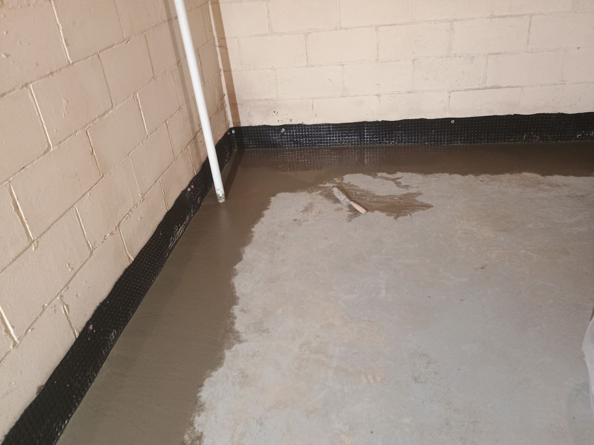 Drain Tile & Sump Pump for Kassie's Rental Property by Waterproofing Northeast