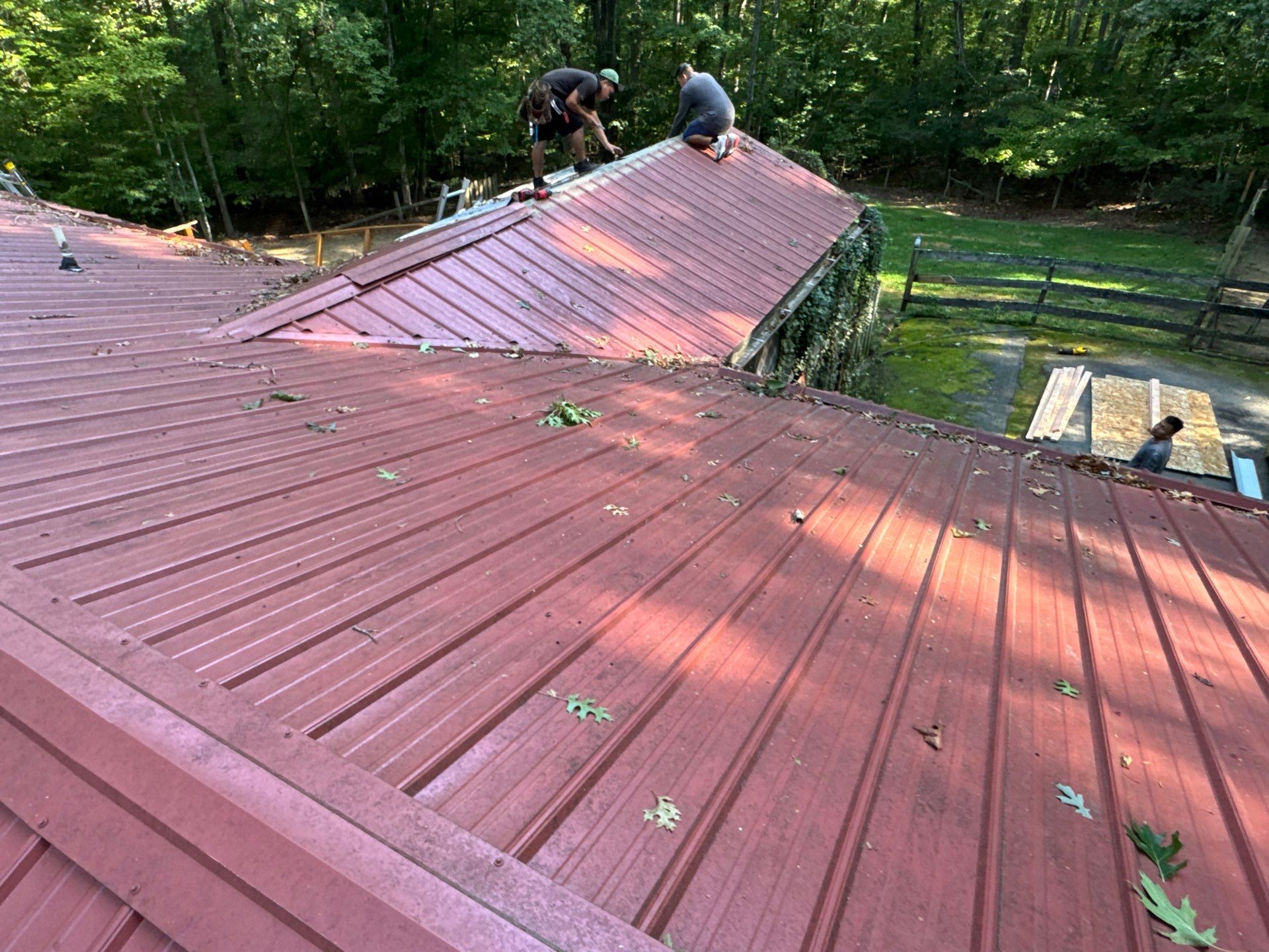 Red Metal Roof Restoration and Wood Fascia Replacement in Barboursville by Cade Construction