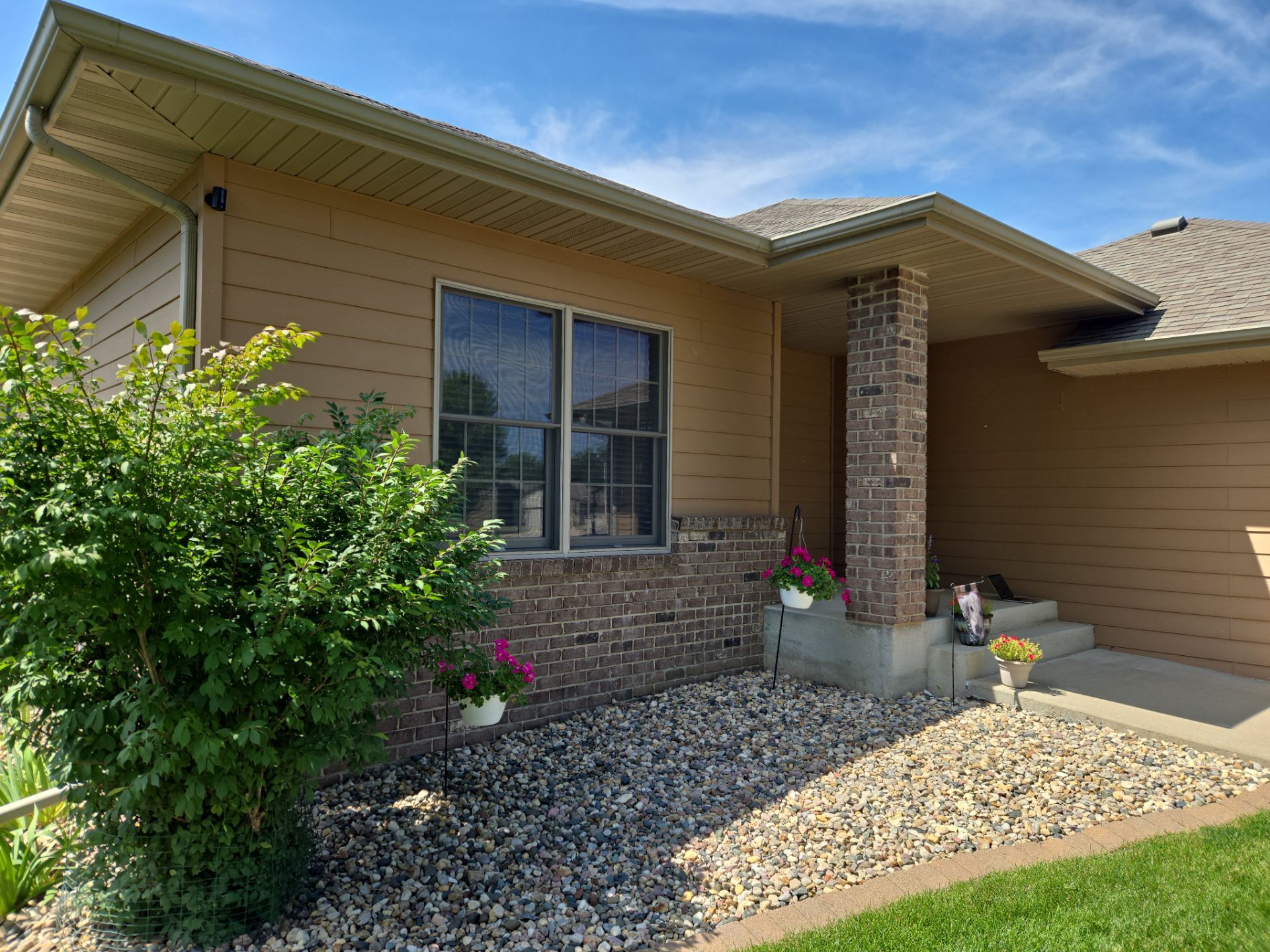 Sioux Falls Residential Exterior Door and Siding Refresh by Select Painting, Coatings & Garage Cabinets