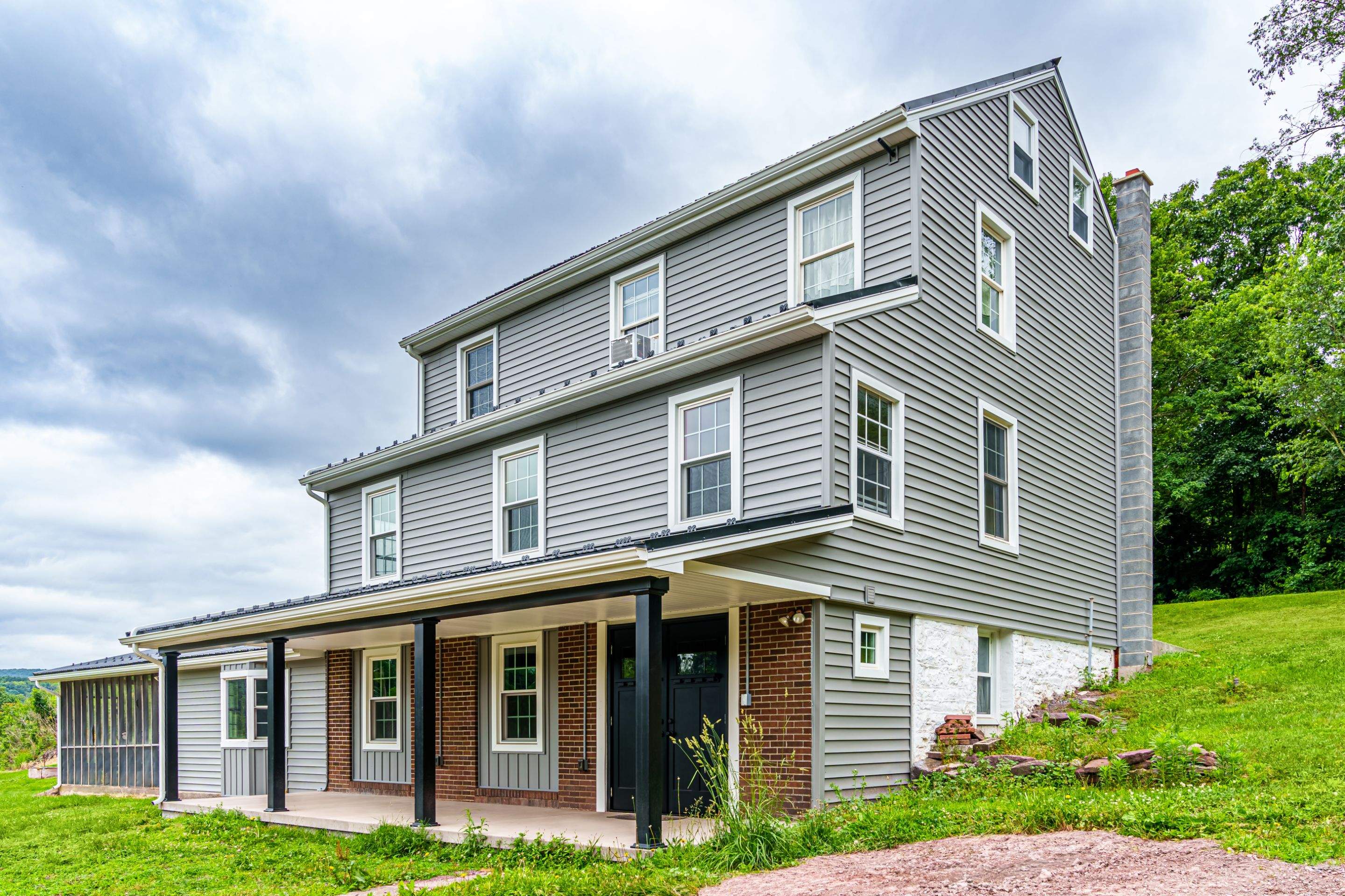 New Metal roof and New siding by Esh Builders