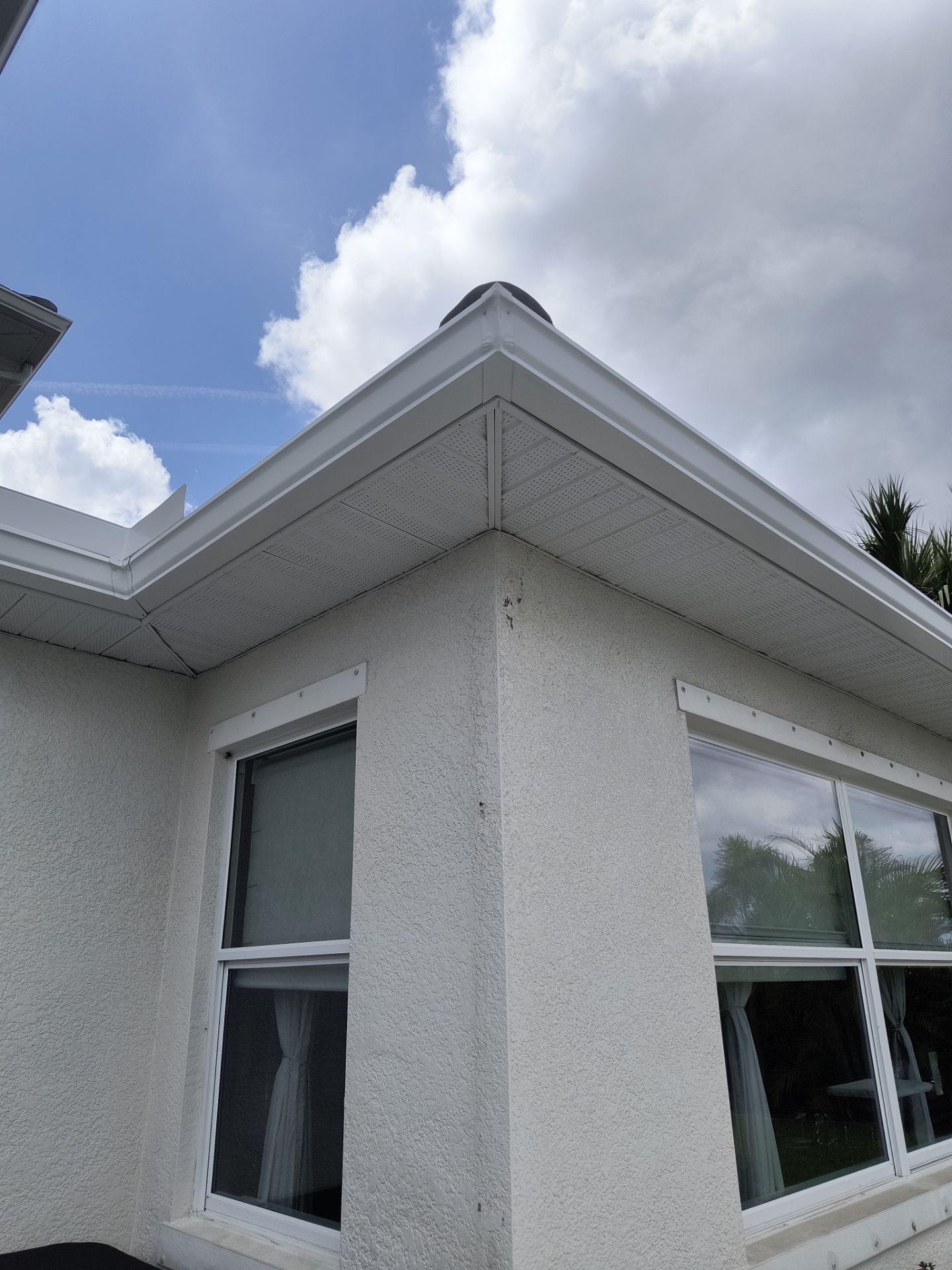 White Seamless Gutters with Downspouts in Bradenton FL by Gutter Professors