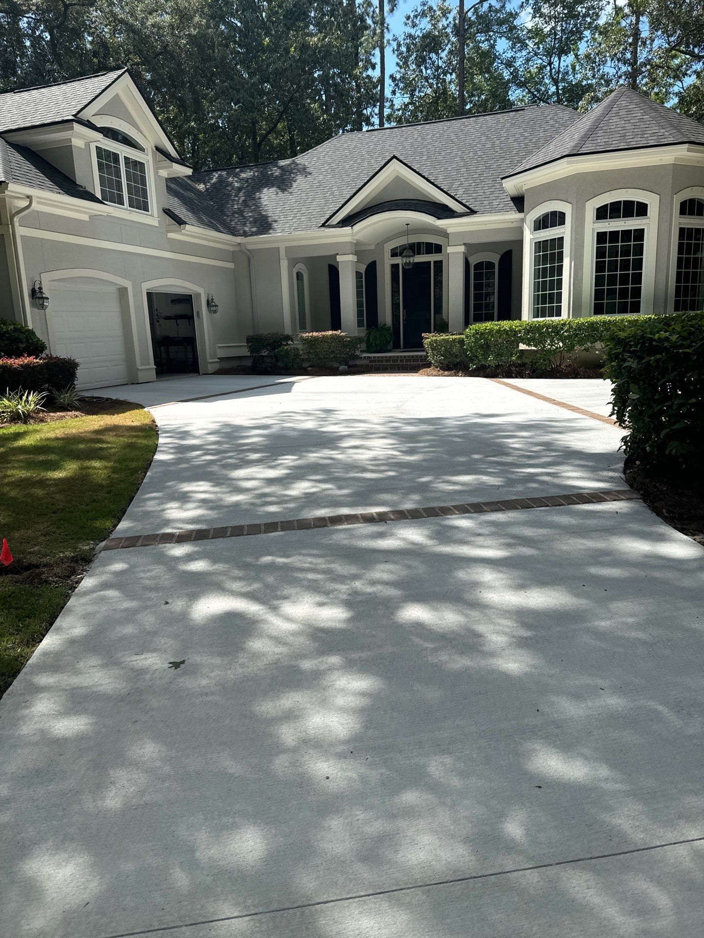 Hilton Head Island Concrete Driveway Replacement with Herringbone Brick Inlays by Lowcountry Scapes, LLC