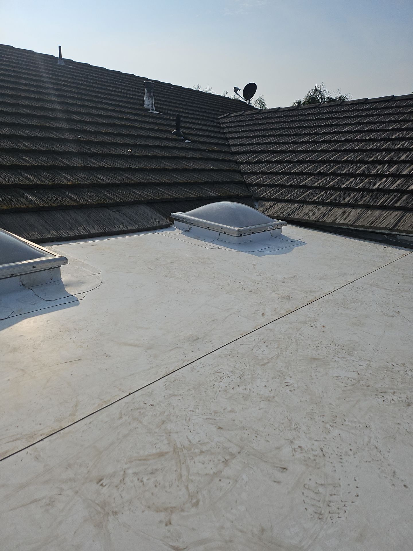 Single-ply roofing system on porch using TPO 60 mil by Straight Edge Roofing Inc