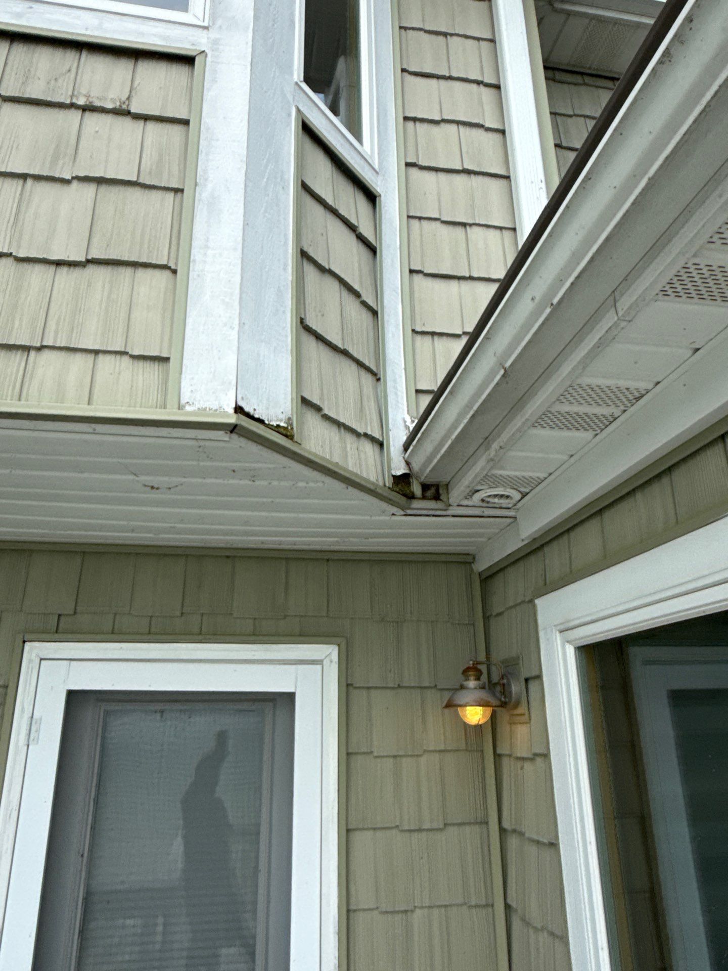Gutter Helmet Protection System for Suttons Bay Home with Cedar Siding by Rainbow Seamless Systems