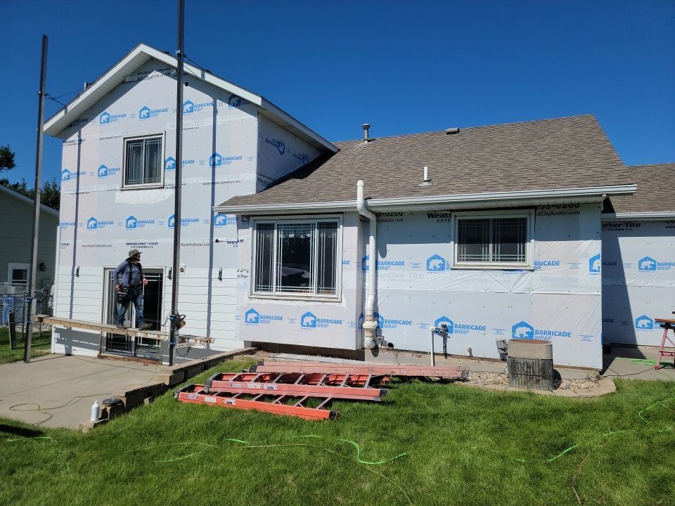 New and Improved Siding by Weather-Tite Exteriors LLC