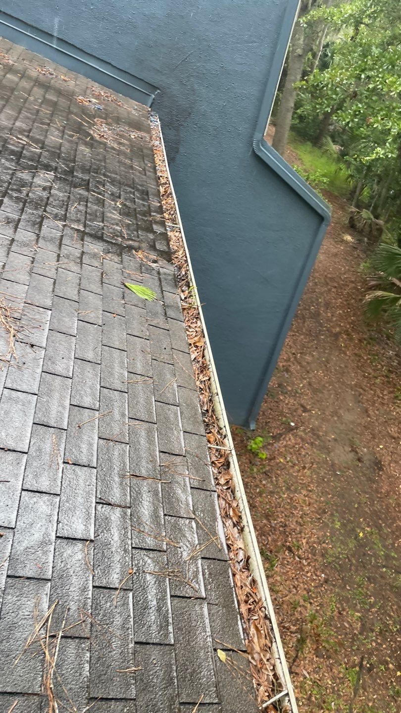 Commercial gutter cleaning Jacksonville, FL before photo with filled gutters