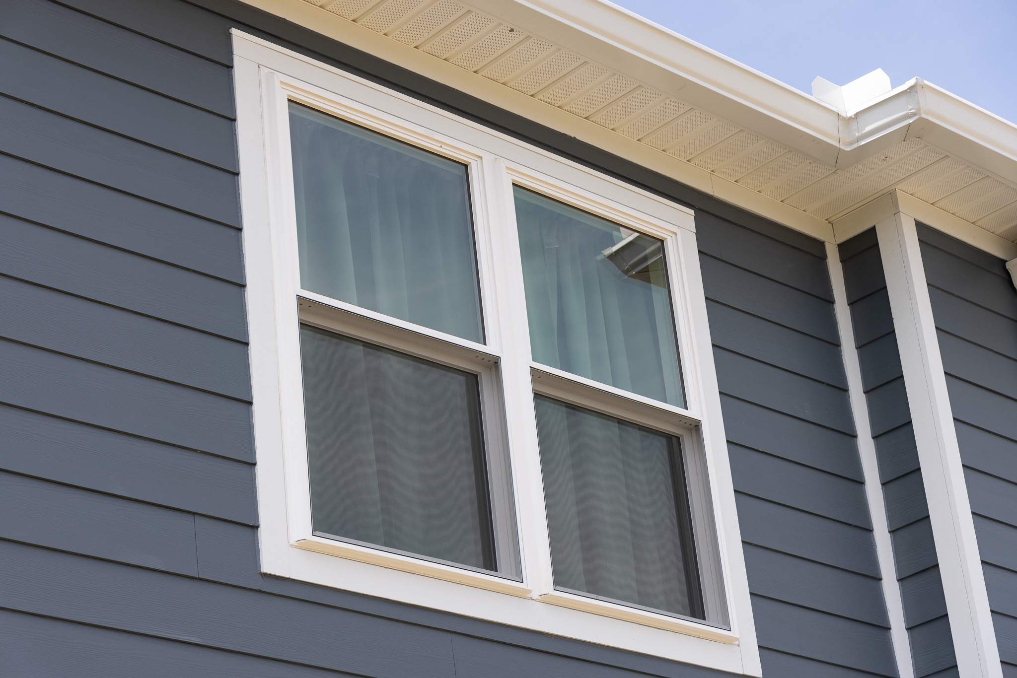 Evening Blue Hardie + Windows by Freedom Exteriors