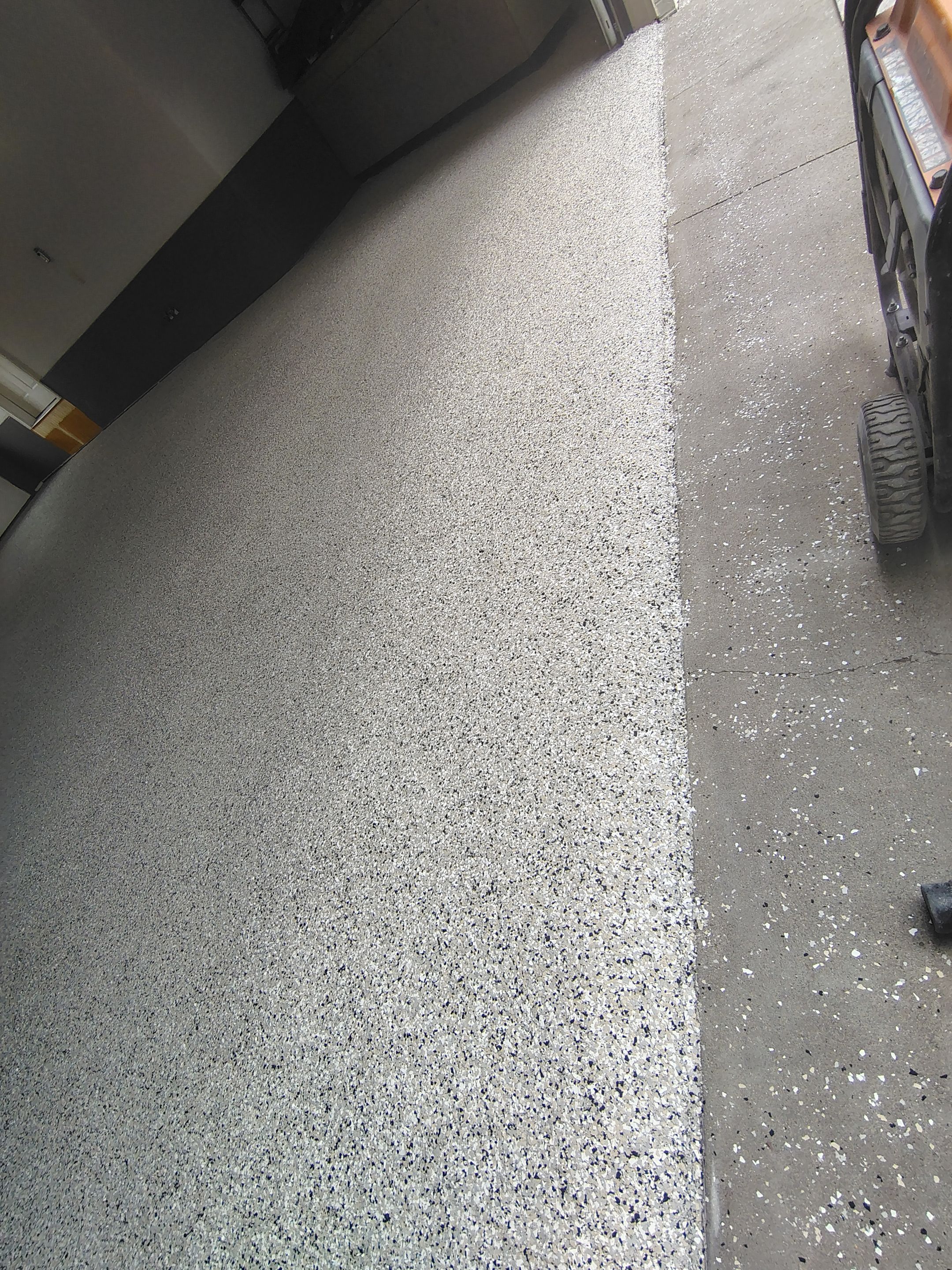 Multi-Fleck Epoxy Garage Floor Coating in Dell Rapids by Select Painting, Coatings & Garage Cabinets