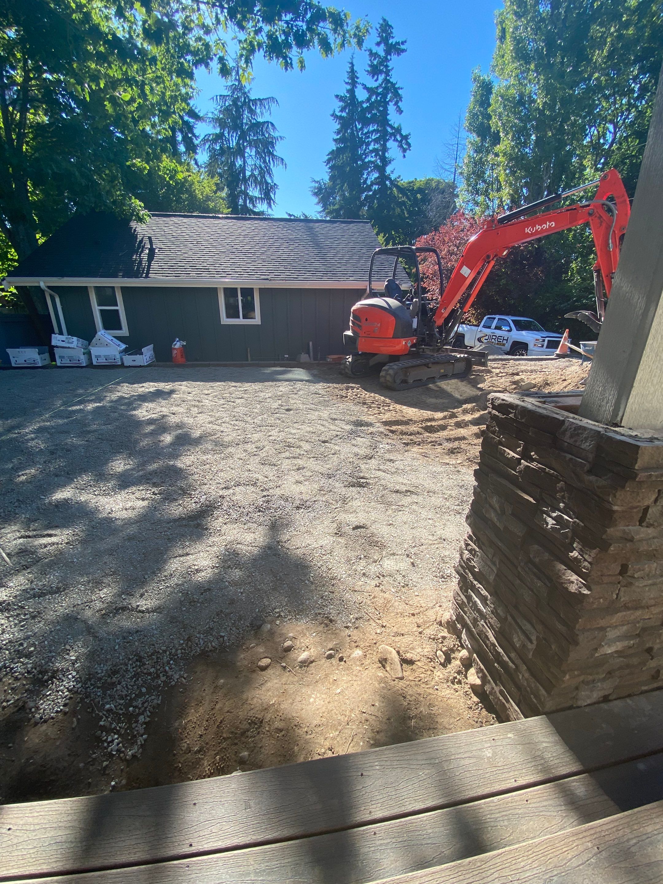 Patio Installation using Concrete, Retaining walls, and Turf install by Jireh Asphalt & Concrete Inc 