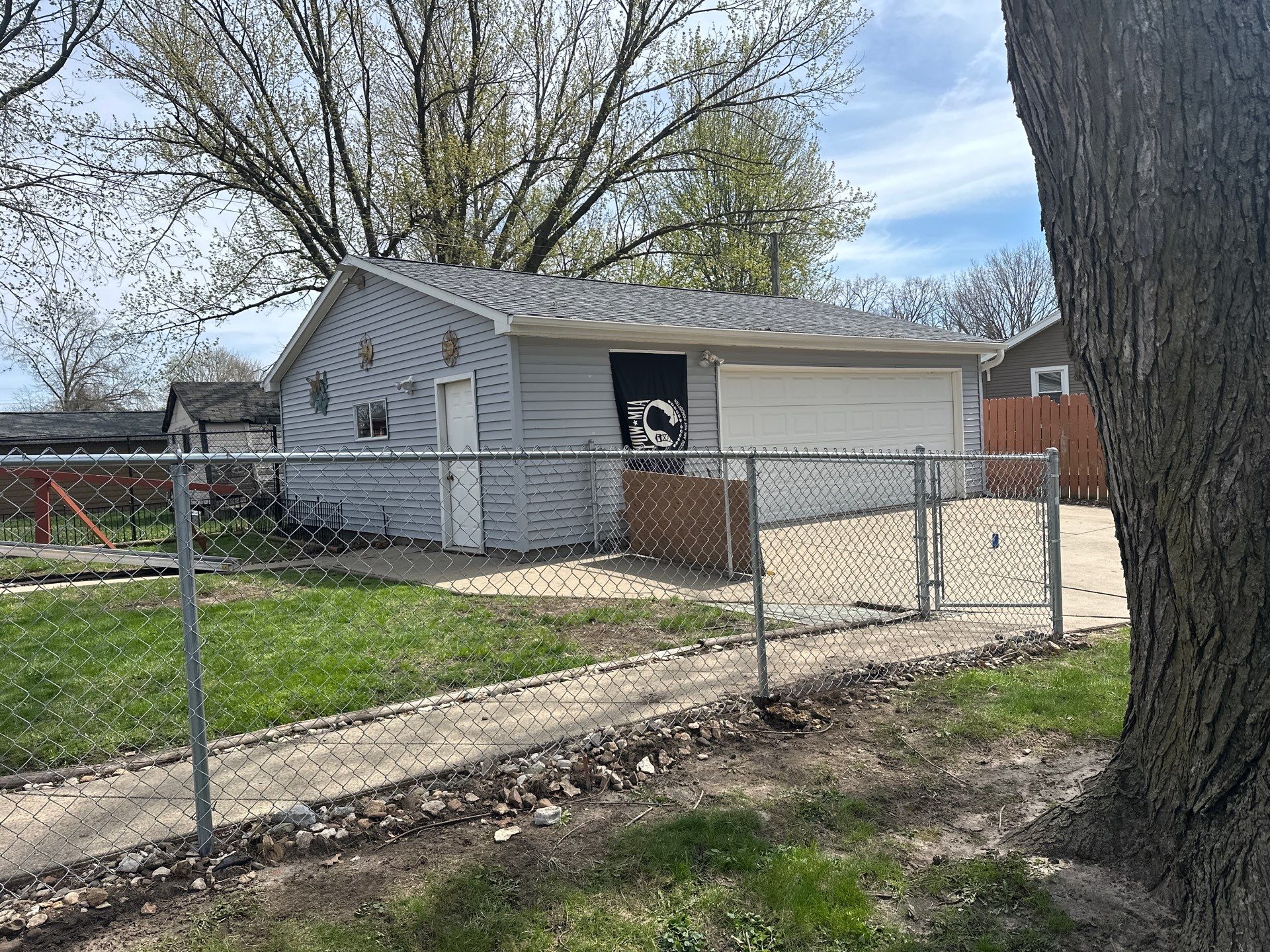 Black Chain Link Fence Installation for Waterloo Residential Backyard by Perfect Picket Fence and Stain