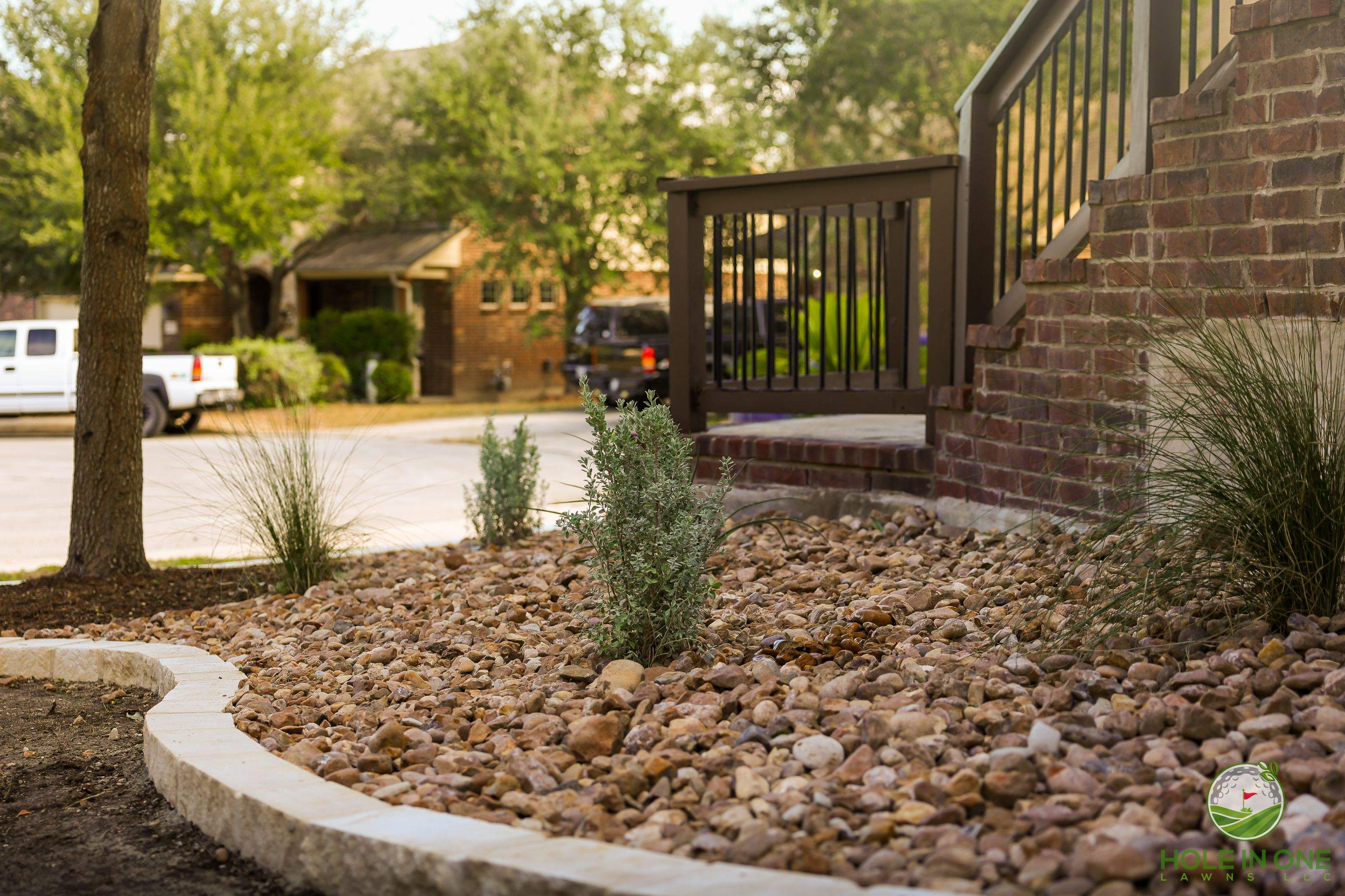 Low-Maintenance Front Yard Xeriscape with Chopstone Border, North San Antonio TX by Hole In One Lawns, LLC