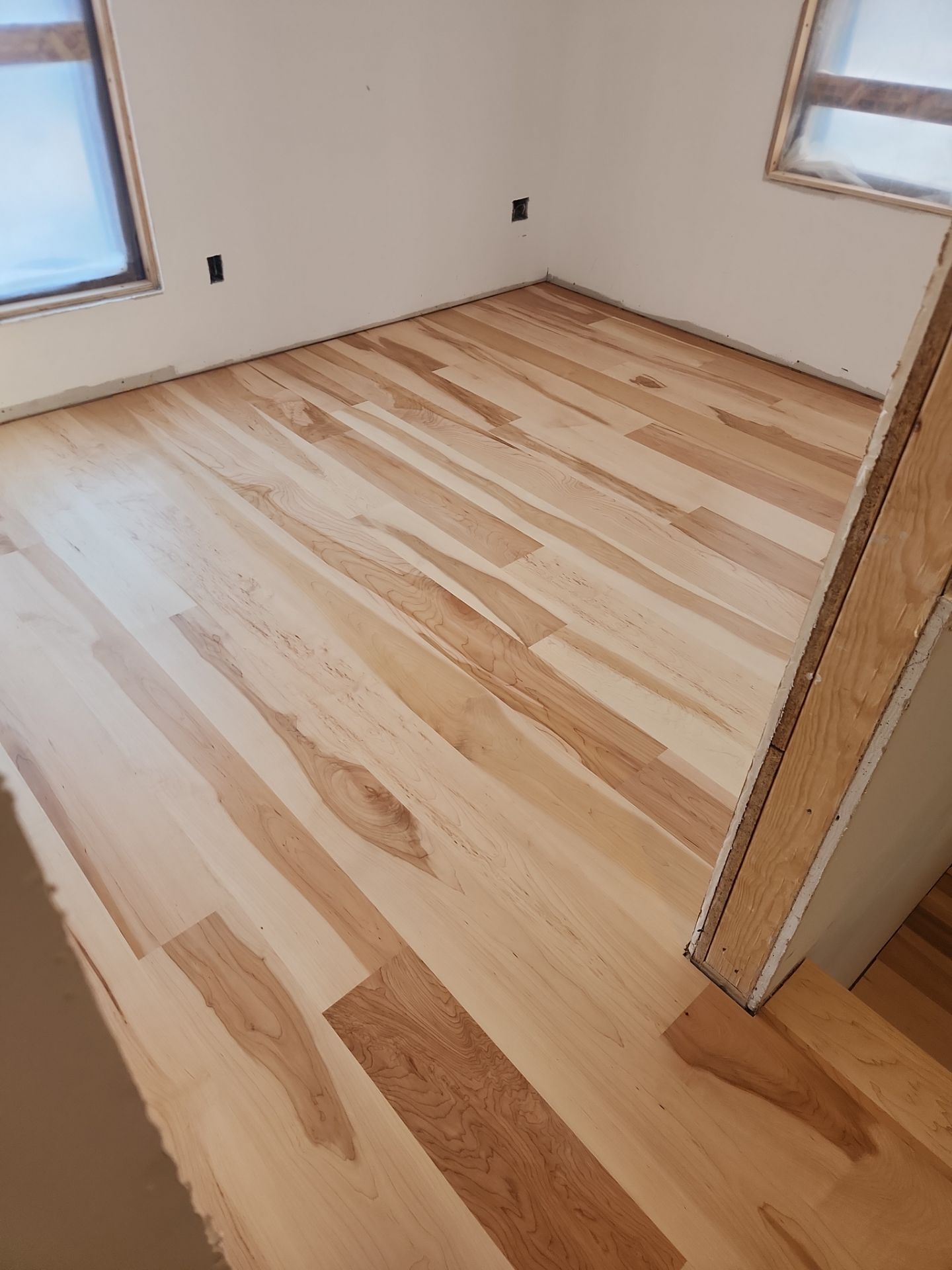 Full glue down Installation over radiant heat 7" Maple character grade by Ann Arbor Hardwoods 