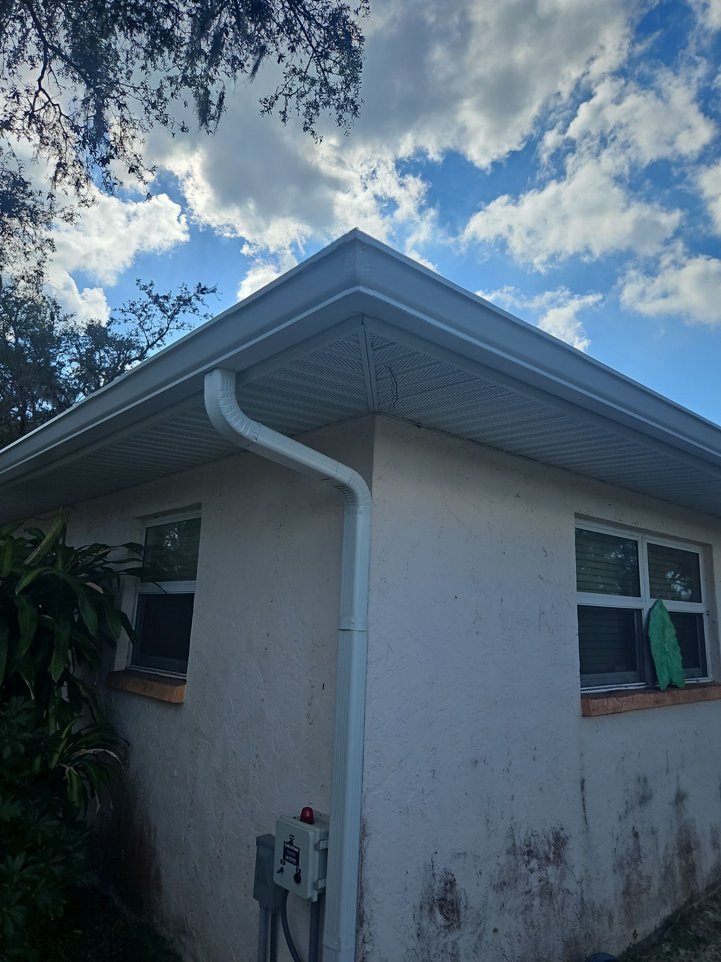 Downspout Installation using White Down Spouts in Sarasota FL by Gutter Professors